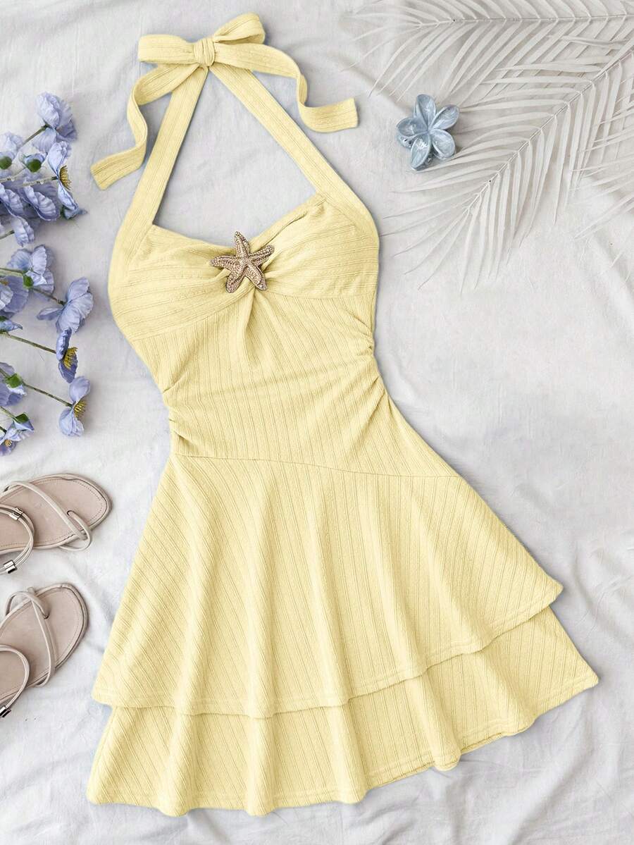 Tween girl summer dress in blue with striped pattern, halter neckline, tie front, sleeveless slim fit, high waist, and tiered ruffle hem for beach vacation and casual holiday wear.