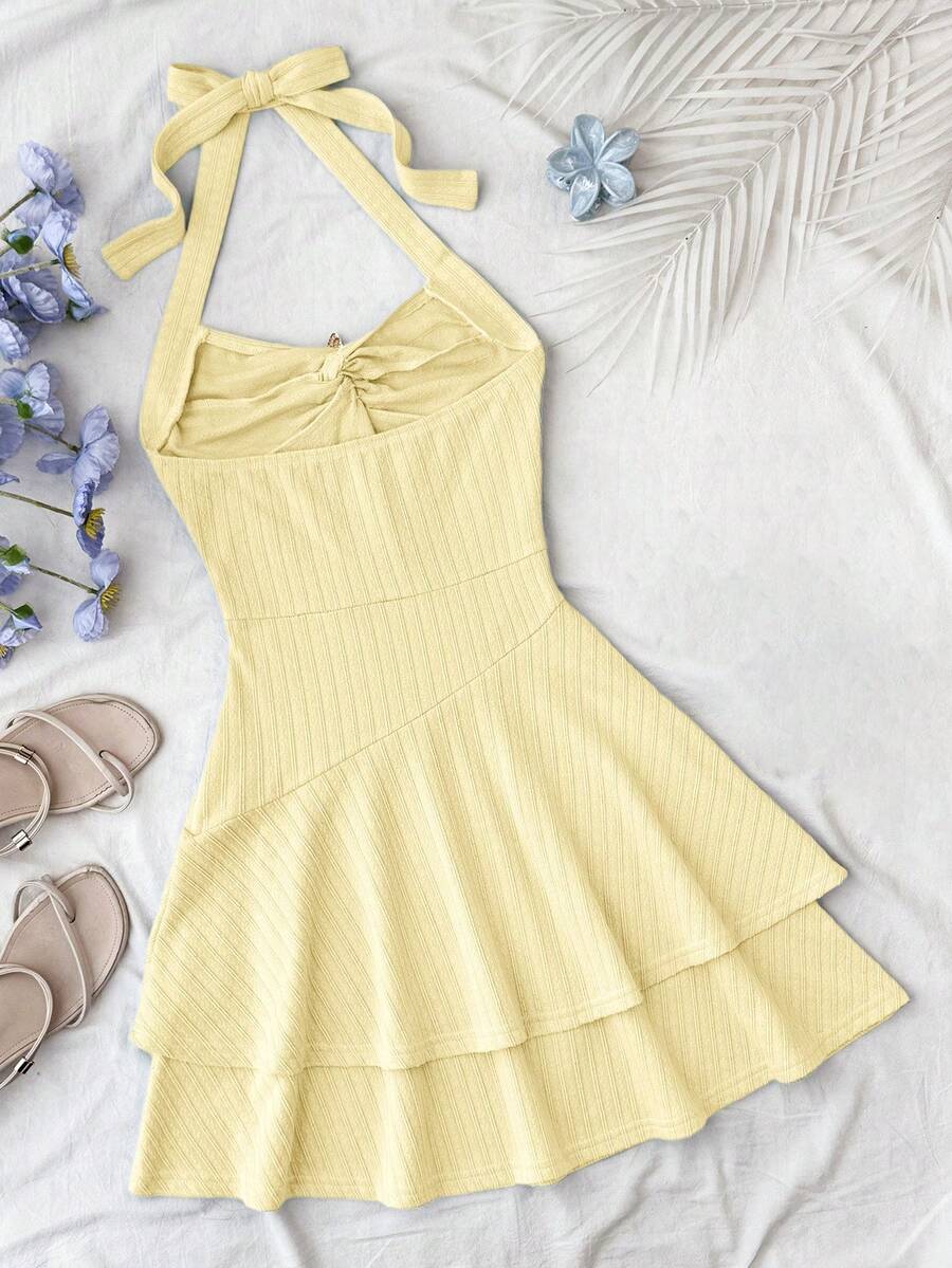 Tween girl summer dress in blue with striped pattern, halter neckline, tie front, sleeveless slim fit, high waist, and tiered ruffle hem for beach vacation and casual holiday wear.
