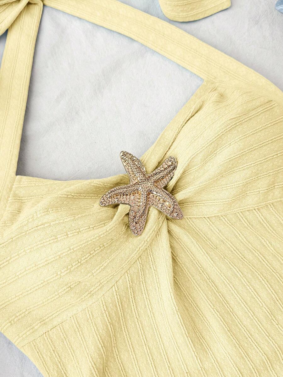 Tween girls yellow halter mini dress with tie front, ruched detail, metallic decor, sleeveless slim fit, and tiered ruffle hem.