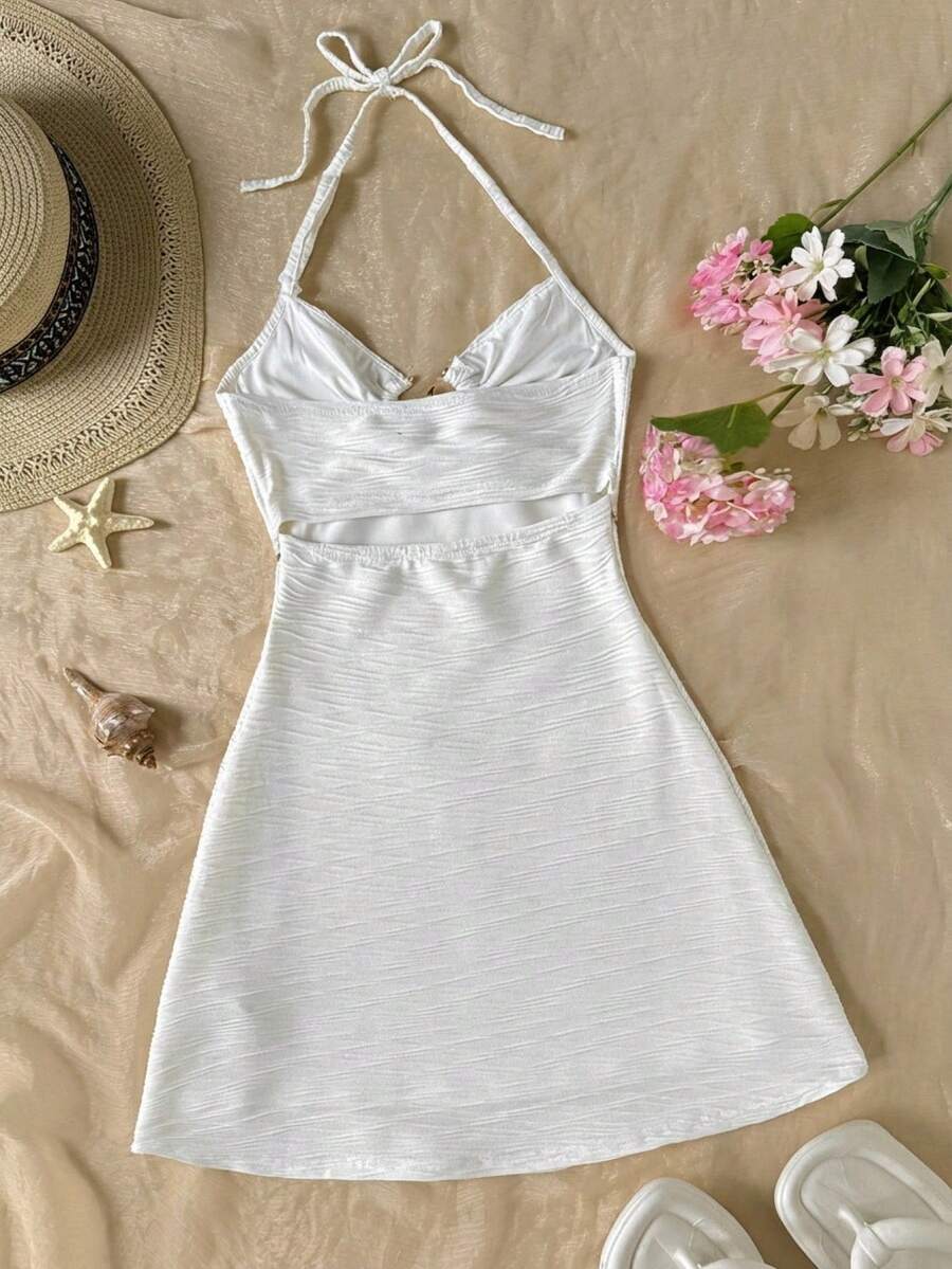 Apricot tween girls sleeveless halter cami dress with appliques, bow front, zipper detail, high waist, flared hem, and short slim fit design.