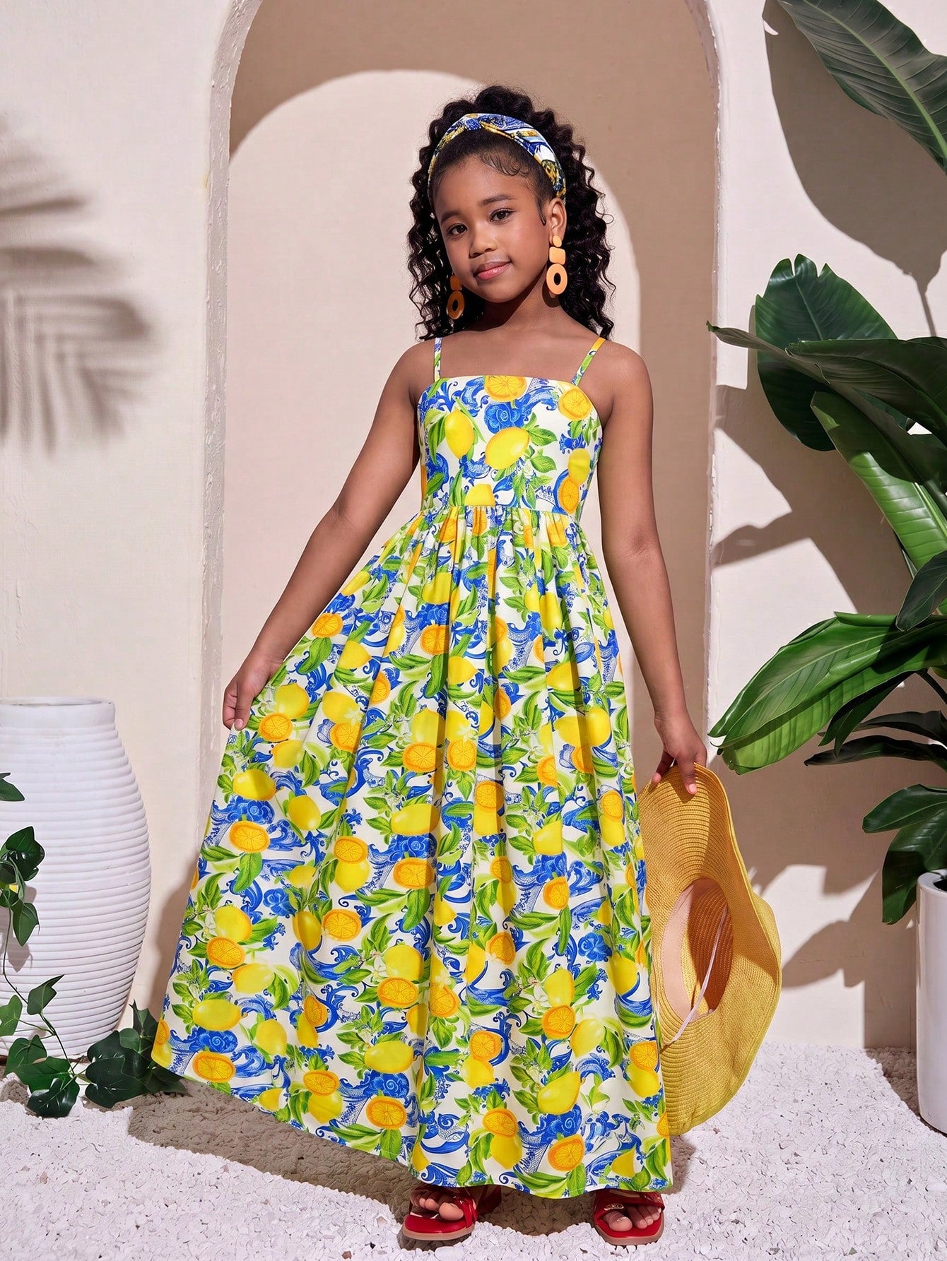 Tween girls striped spaghetti strap cami dress with high waist, shirred detail, zipper closure, sleeveless design, and flared long A-line silhouette for vacation wear.