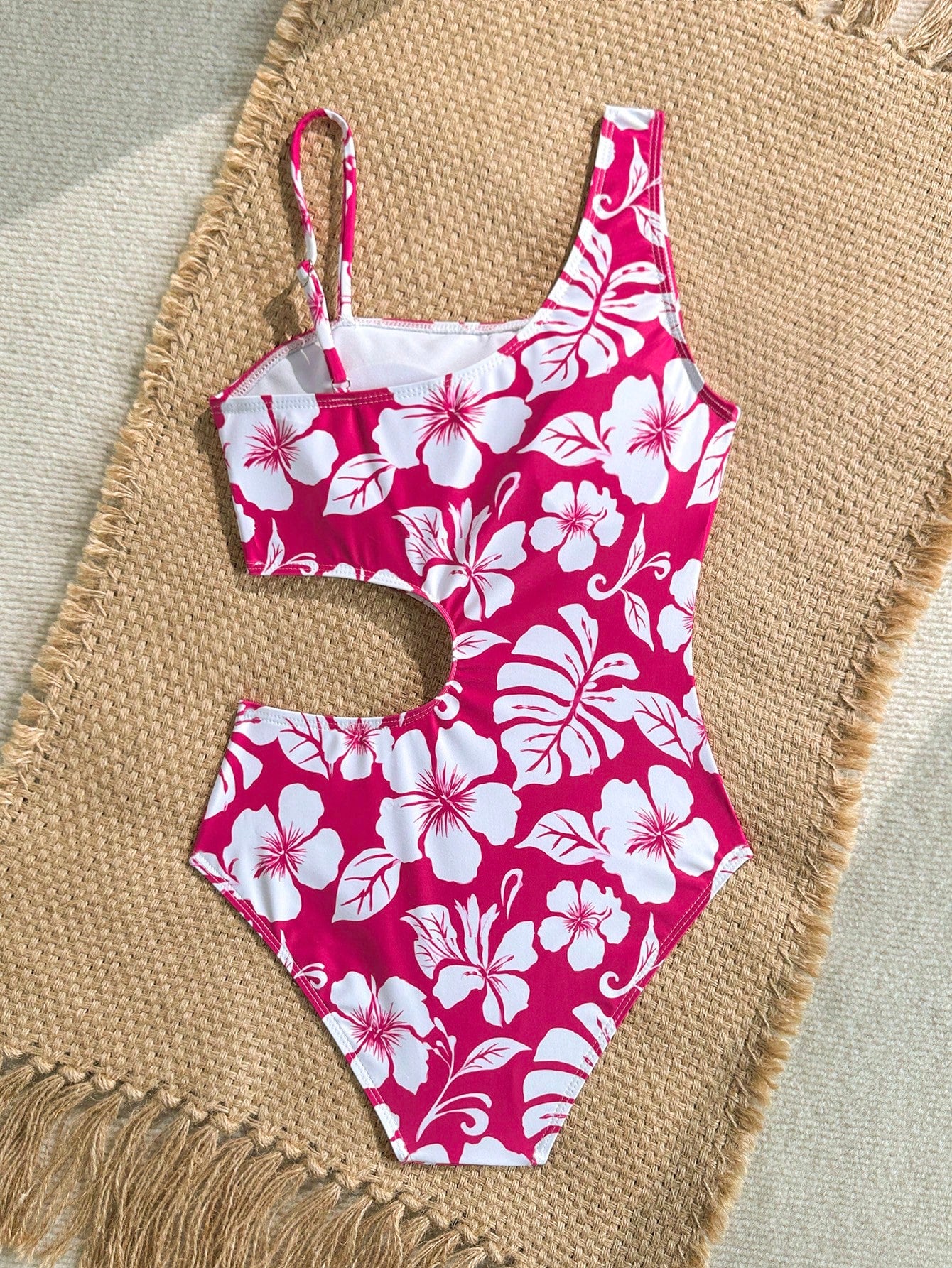 Tween girls' black and white one-piece swimsuit with striped patchwork design, scoop neck, asymmetrical cut-out detail, and fitted vacation swimwear style.