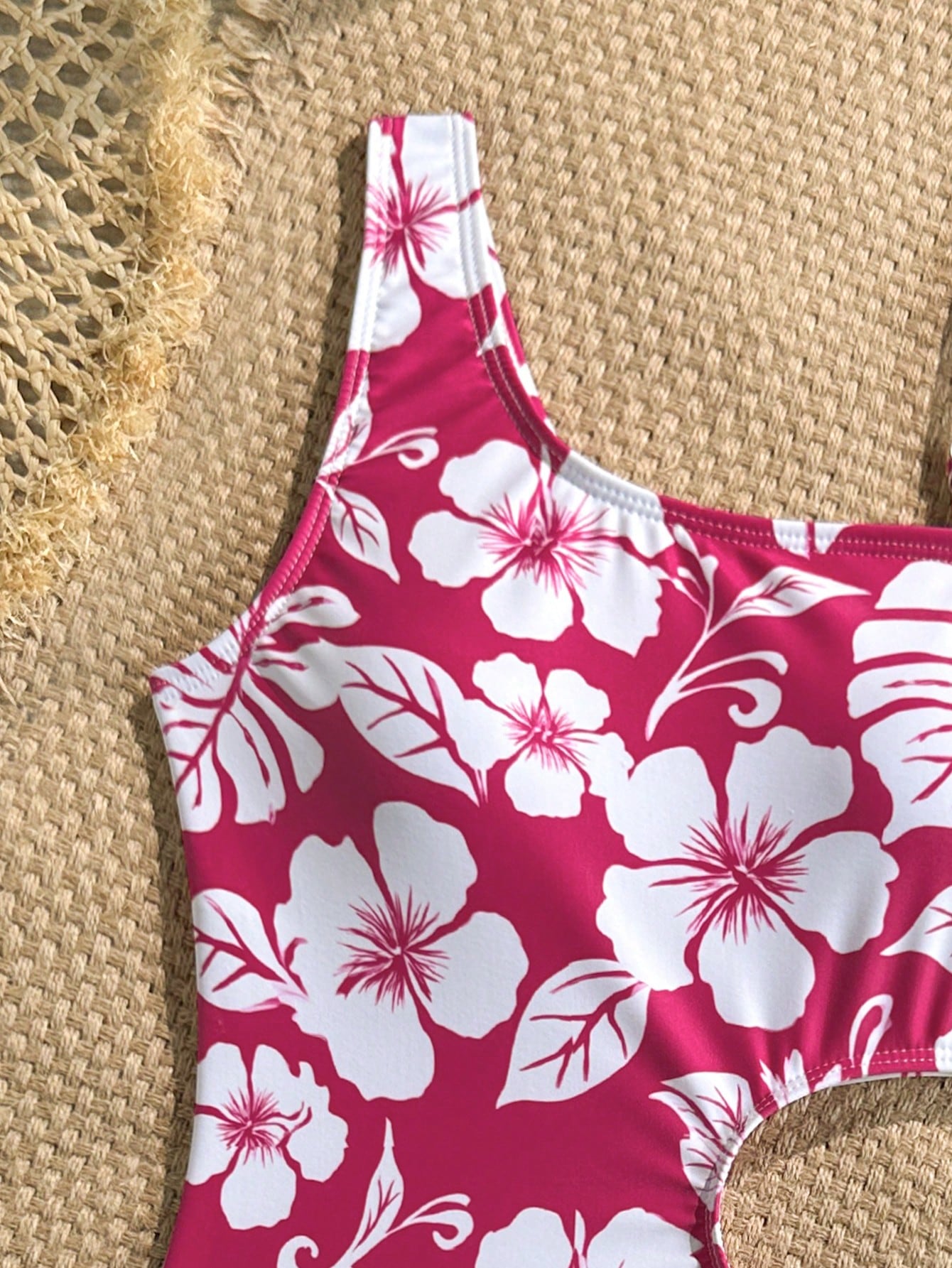 Tween girls' black and white one-piece swimsuit with striped patchwork design, scoop neck, asymmetrical cut-out detail, and fitted vacation swimwear style.