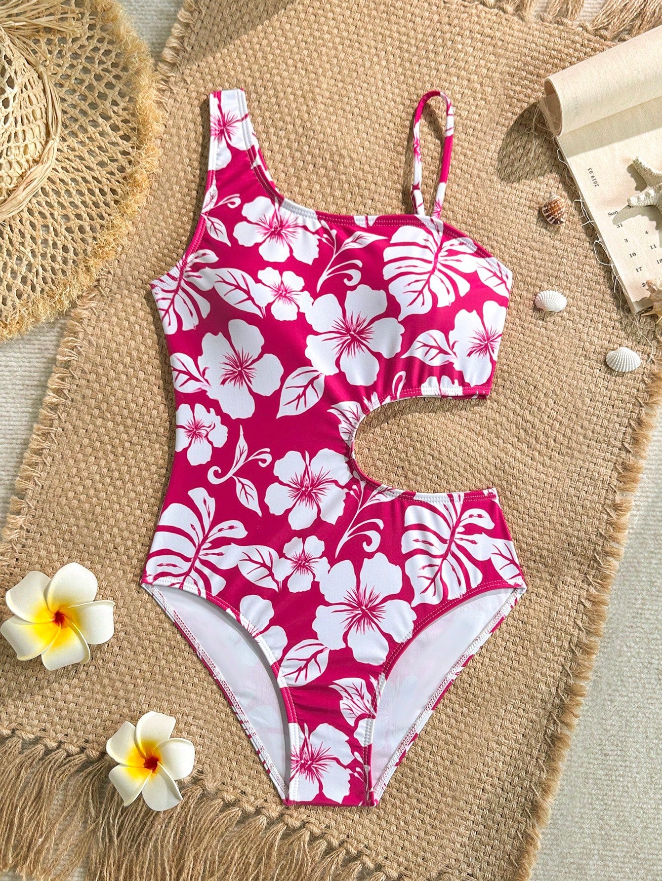 Tween girls' black and white one-piece swimsuit with striped patchwork design, scoop neck, asymmetrical cut-out detail, and fitted vacation swimwear style.