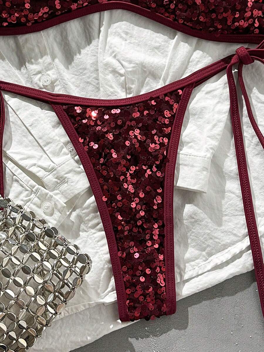 Apricot 2-piece sequin textured halter bikini set featuring a wireless top with lace-up backless ties and matching low-waist side-tie thong bottoms.