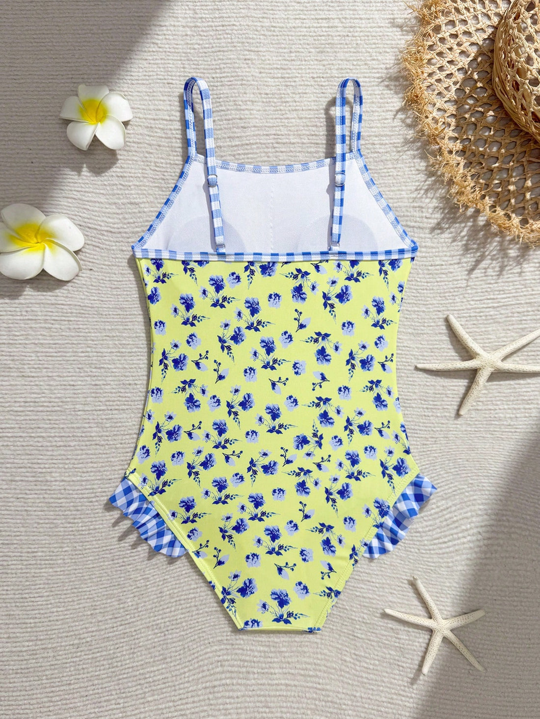 Tween girl plaid all-over print one-piece swimsuit with ruffle detail, spaghetti straps, fitted shape, and multicolor patchwork style for beach or pool wear.