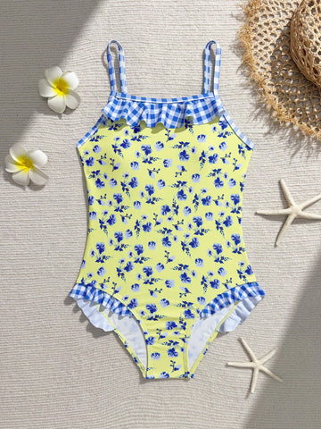 Tween girl plaid all-over print one-piece swimsuit with ruffle detail, spaghetti straps, fitted shape, and multicolor patchwork style for beach or pool wear.
