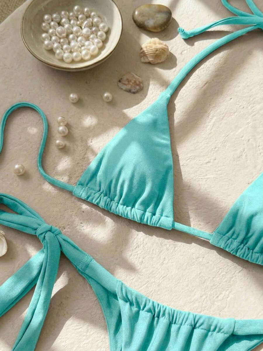 Army green high waist micro bikini swimsuit set for women featuring wireless spaghetti strap top with chain knot details and tie side thong bottoms.