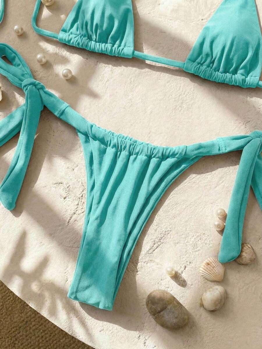 Army green high waist micro bikini swimsuit set for women featuring wireless spaghetti strap top with chain knot details and tie side thong bottoms.