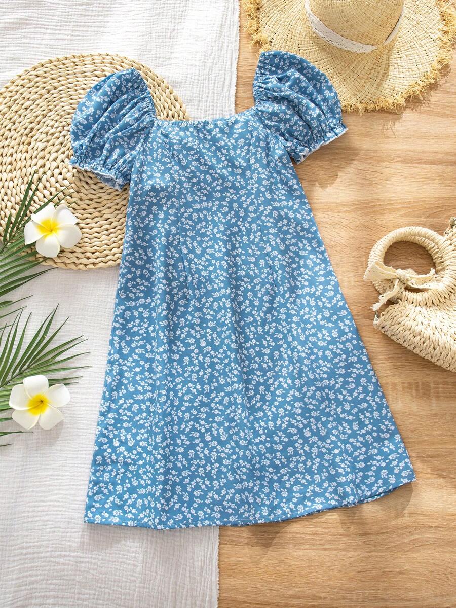 Black floral all-over print midi dress for tween girls featuring puff half sleeves, spaghetti strap neckline, and an A-line silhouette.