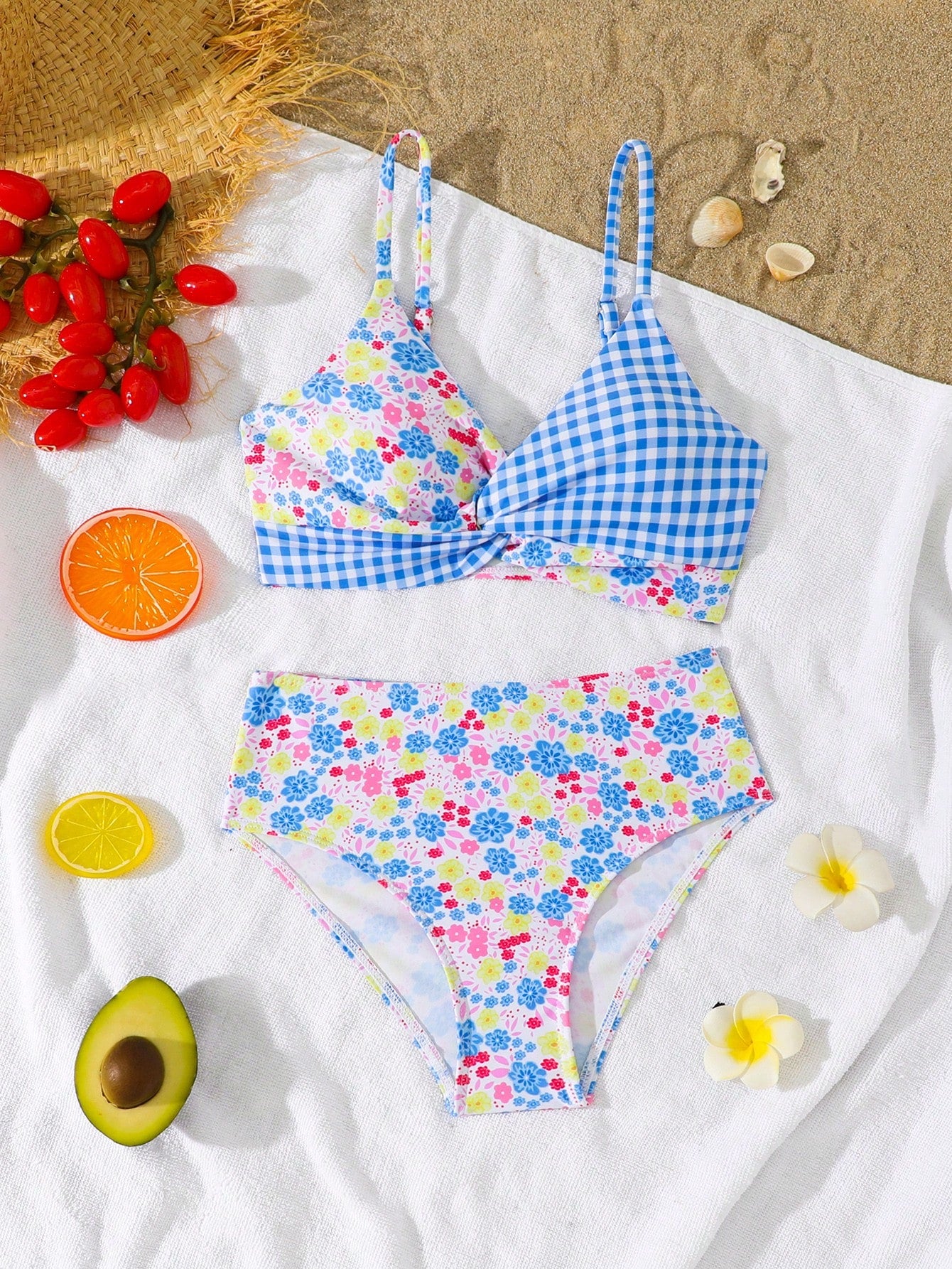 Tween girls 2-piece ditsy floral bikini set featuring a spaghetti strap top with center string detail and matching bottoms with side strings, designed for swimming, vacation, and summer wear.