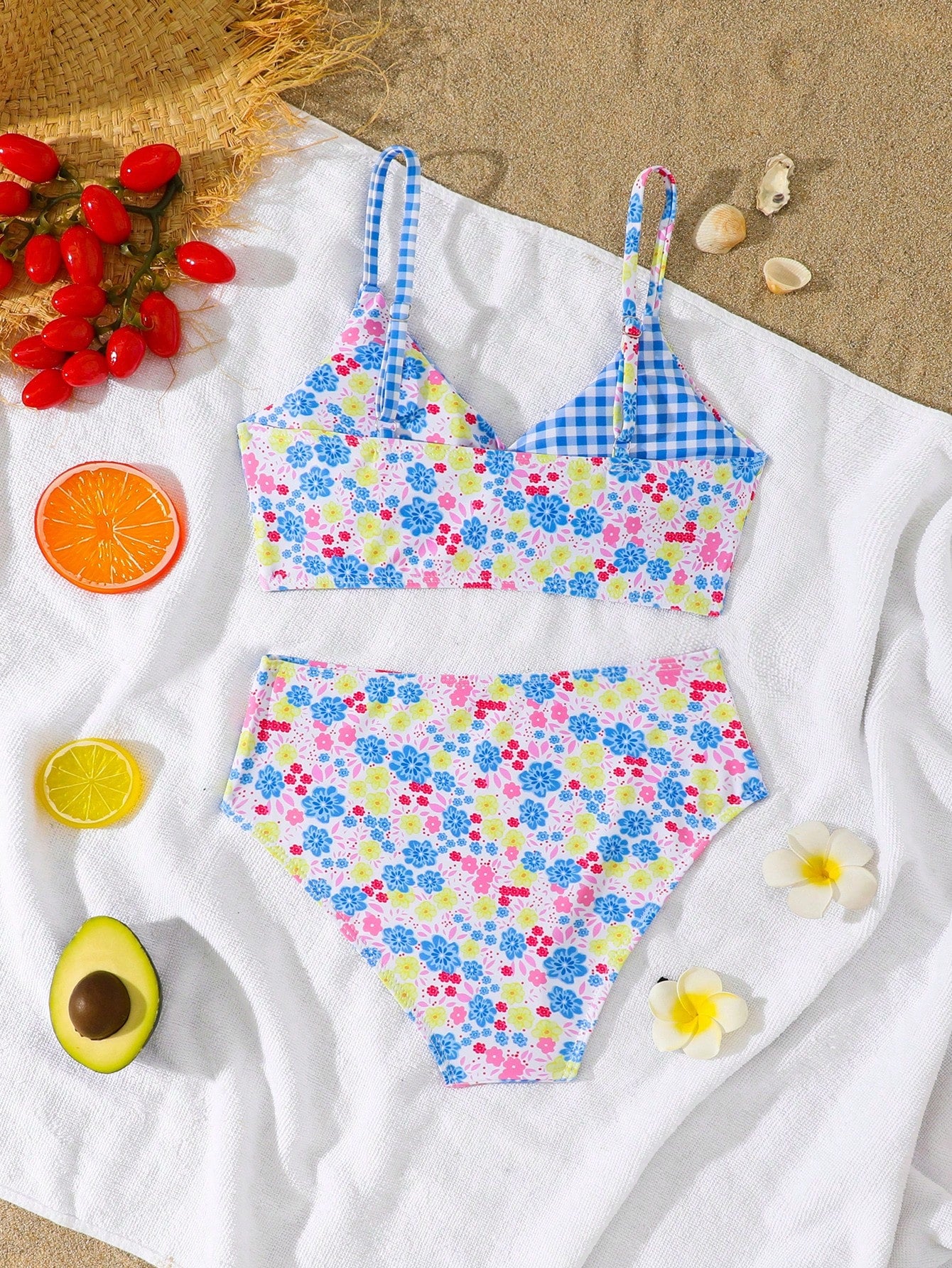 Tween girls 2-piece ditsy floral bikini set featuring a spaghetti strap top with center string detail and matching bottoms with side strings, designed for swimming, vacation, and summer wear.