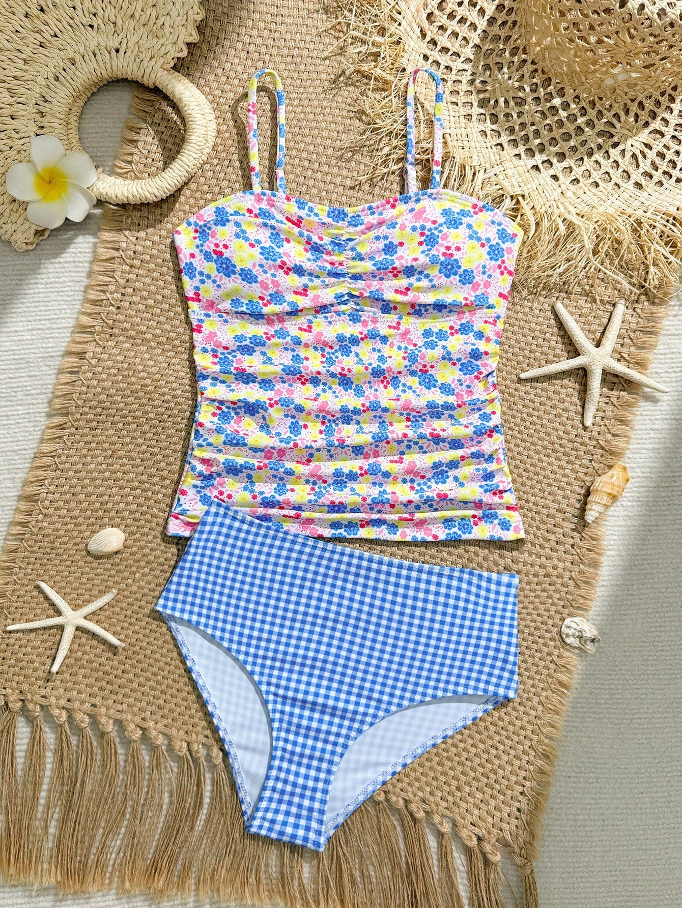 Tween girls 2-piece bikini swimwear set in black with a wave-pattern geometric design, featuring halter neckline, wireless top, and high-waist short bottoms with starfish and shell decor.