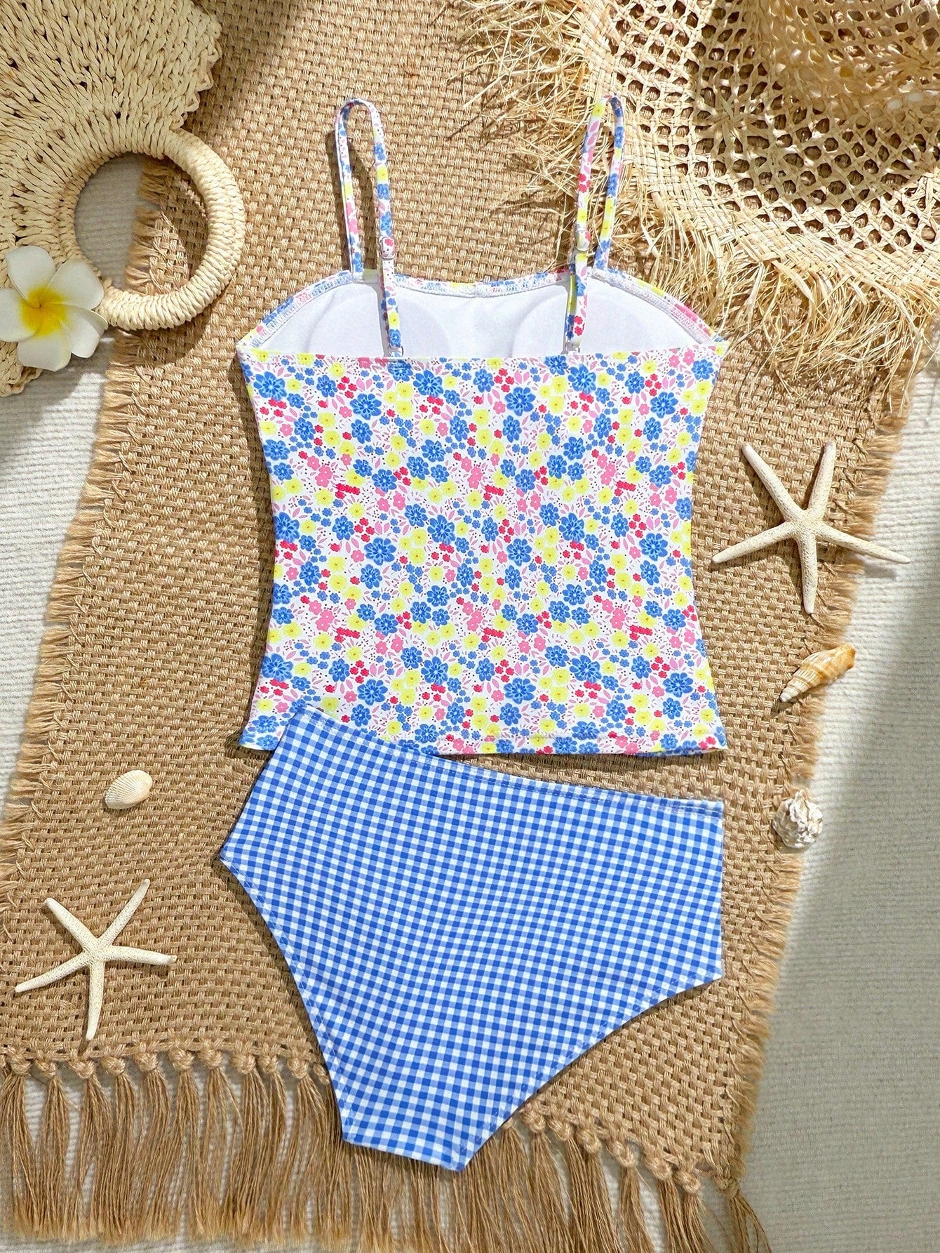 Tween girls 2-piece bikini swimwear set in black with a wave-pattern geometric design, featuring halter neckline, wireless top, and high-waist short bottoms with starfish and shell decor.