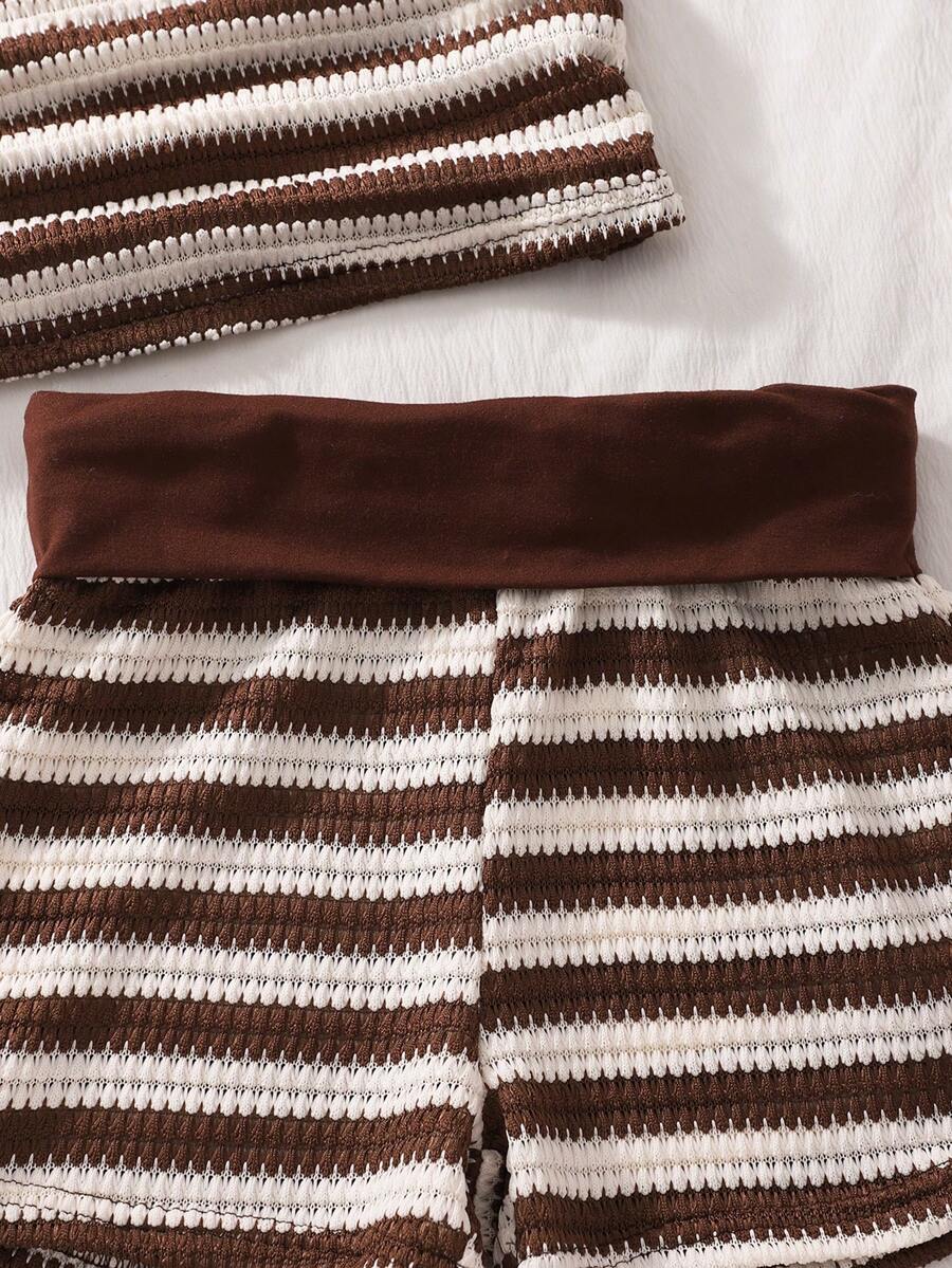 Tween girls black and white striped two-piece set featuring a spaghetti strap micro crop tank top with lettuce trim and ruffle hem paired with matching slim fit shorts.