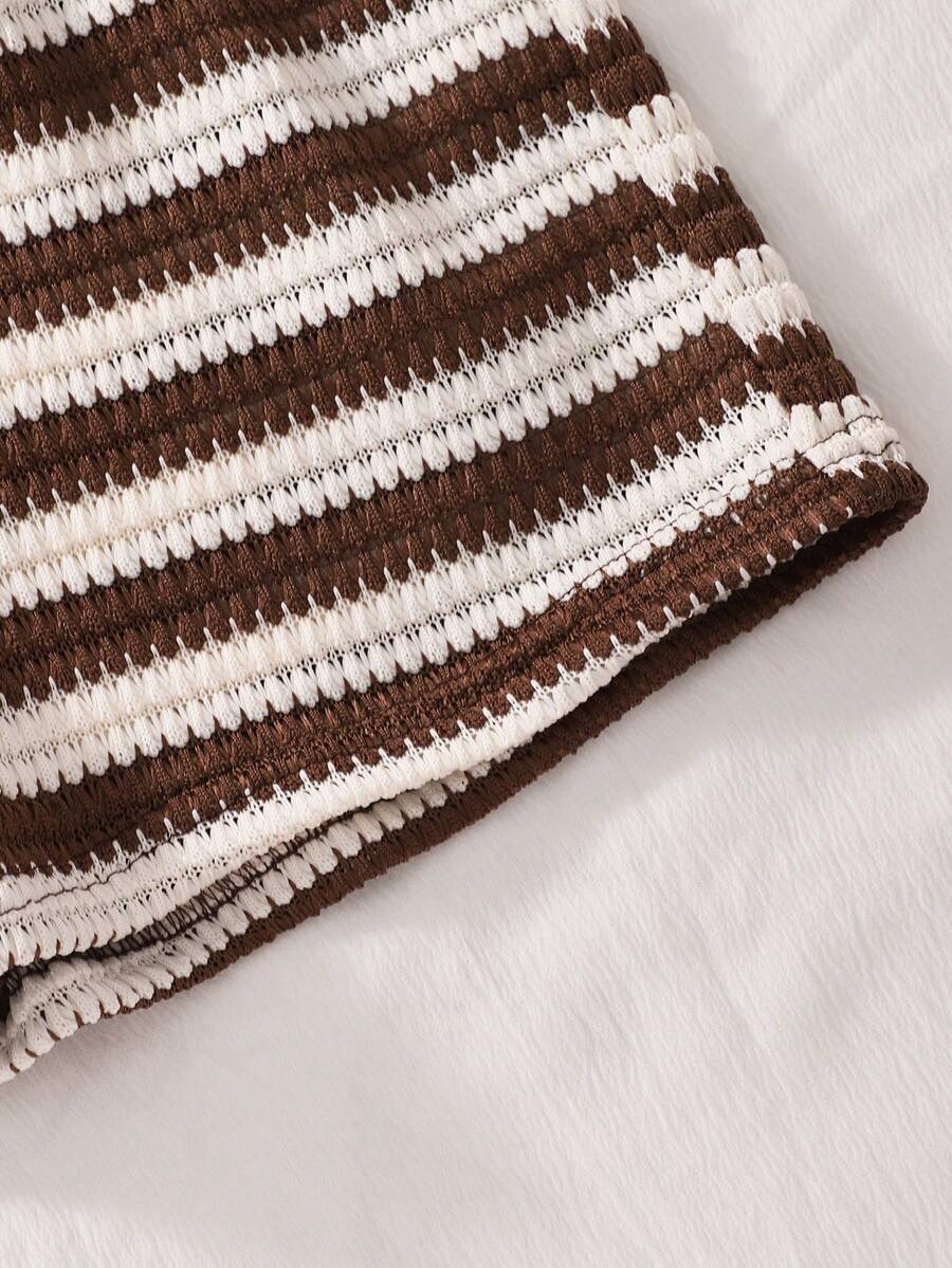Tween girls black and white striped two-piece set featuring a spaghetti strap micro crop tank top with lettuce trim and ruffle hem paired with matching slim fit shorts.