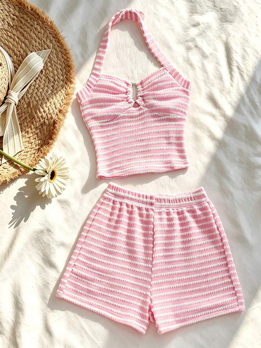 Tween girls black and white striped two-piece set featuring a spaghetti strap micro crop tank top with lettuce trim and ruffle hem paired with matching slim fit shorts.