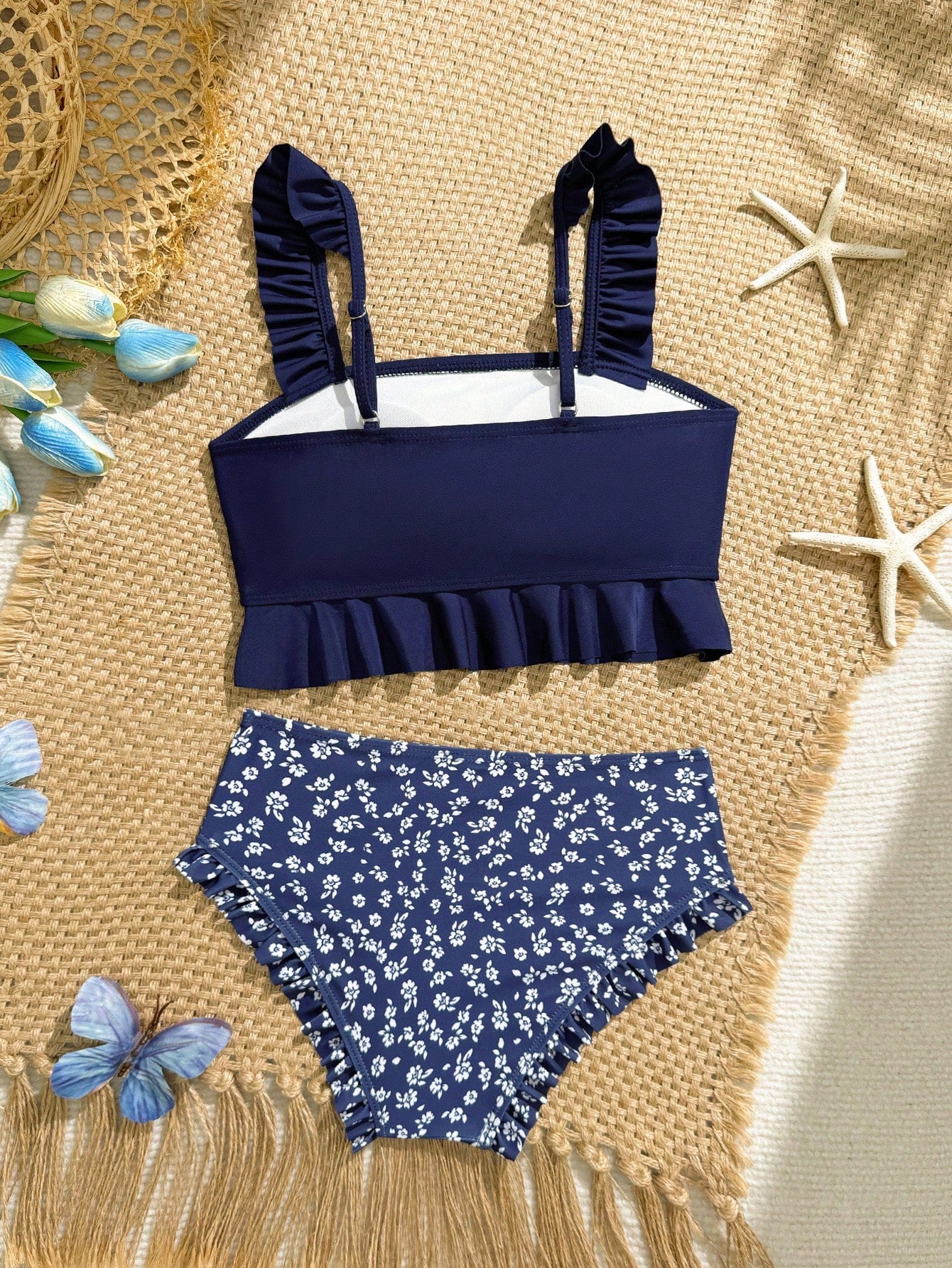 Tween girls solid color 2-piece bikini swimwear set with ruffle detail, strap neckline, wireless bikini top, and triangle mid-waist bikini bottoms; textured pattern with lined bottoms and high-stretch fabric, suitable for summer vacation.