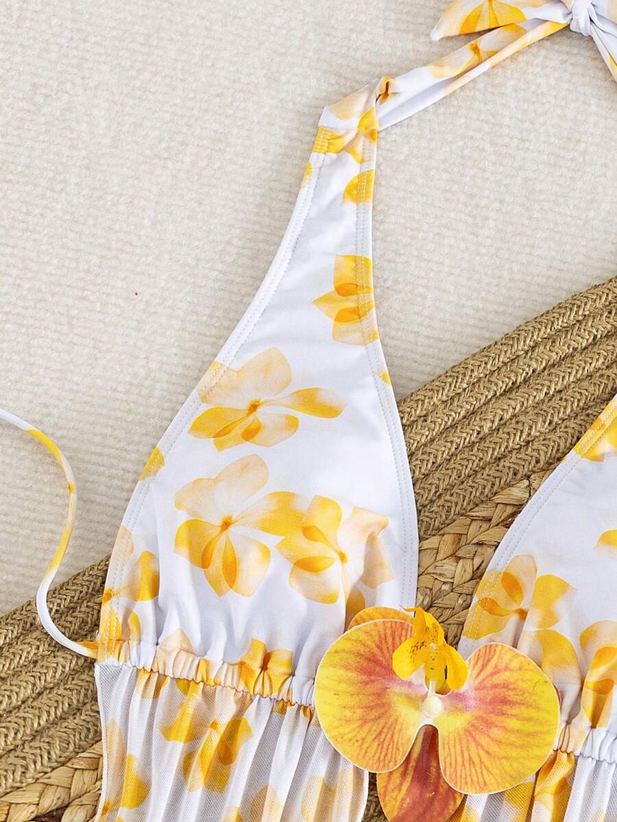 Women's 3-piece floral bikini set featuring a multicolor plant print halter top with 3D rose detail, matching bikini bottoms, and short skirt cover-up