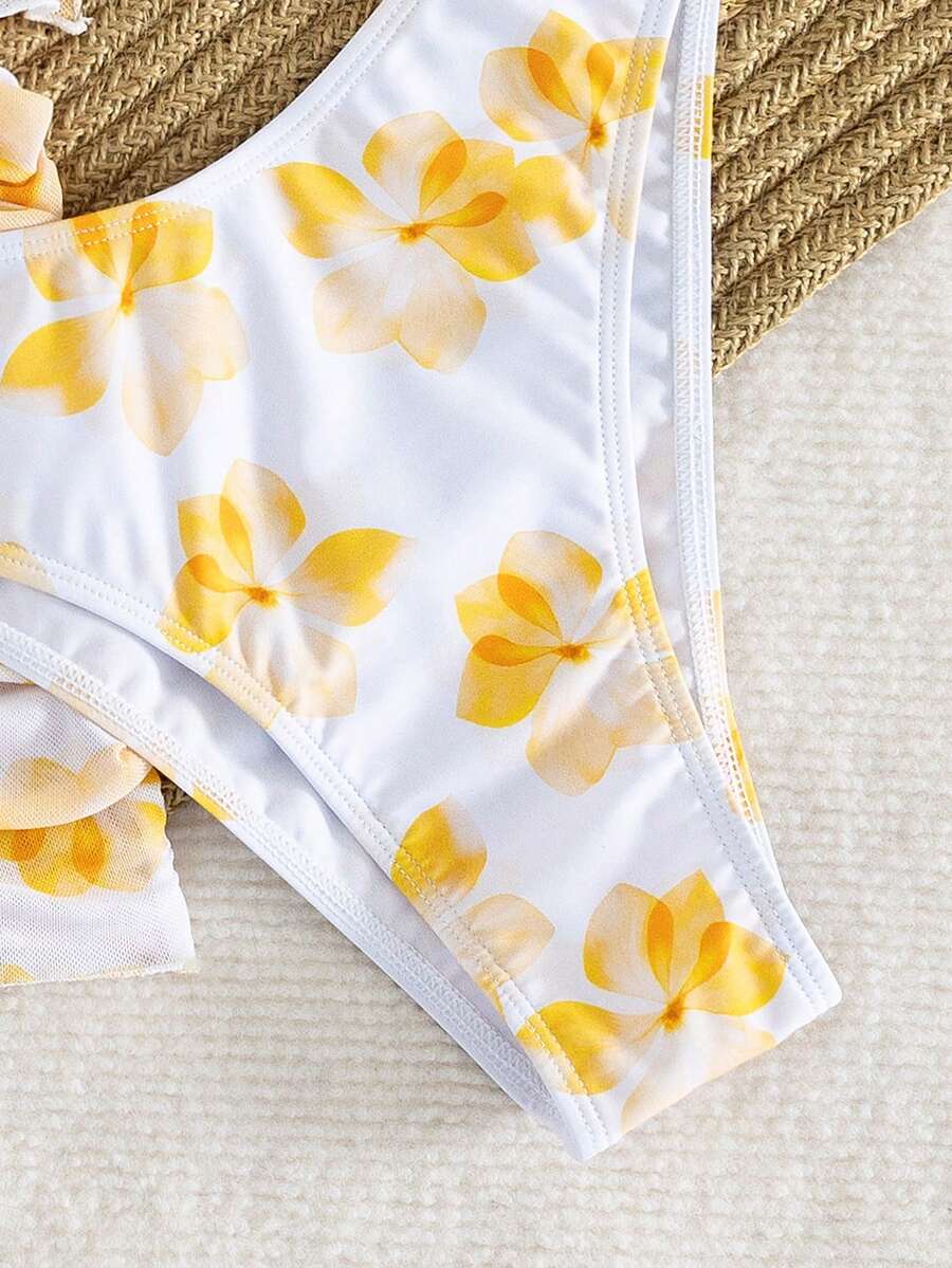 Women's 3-piece floral bikini set featuring a multicolor plant print halter top with 3D rose detail, matching bikini bottoms, and short skirt cover-up