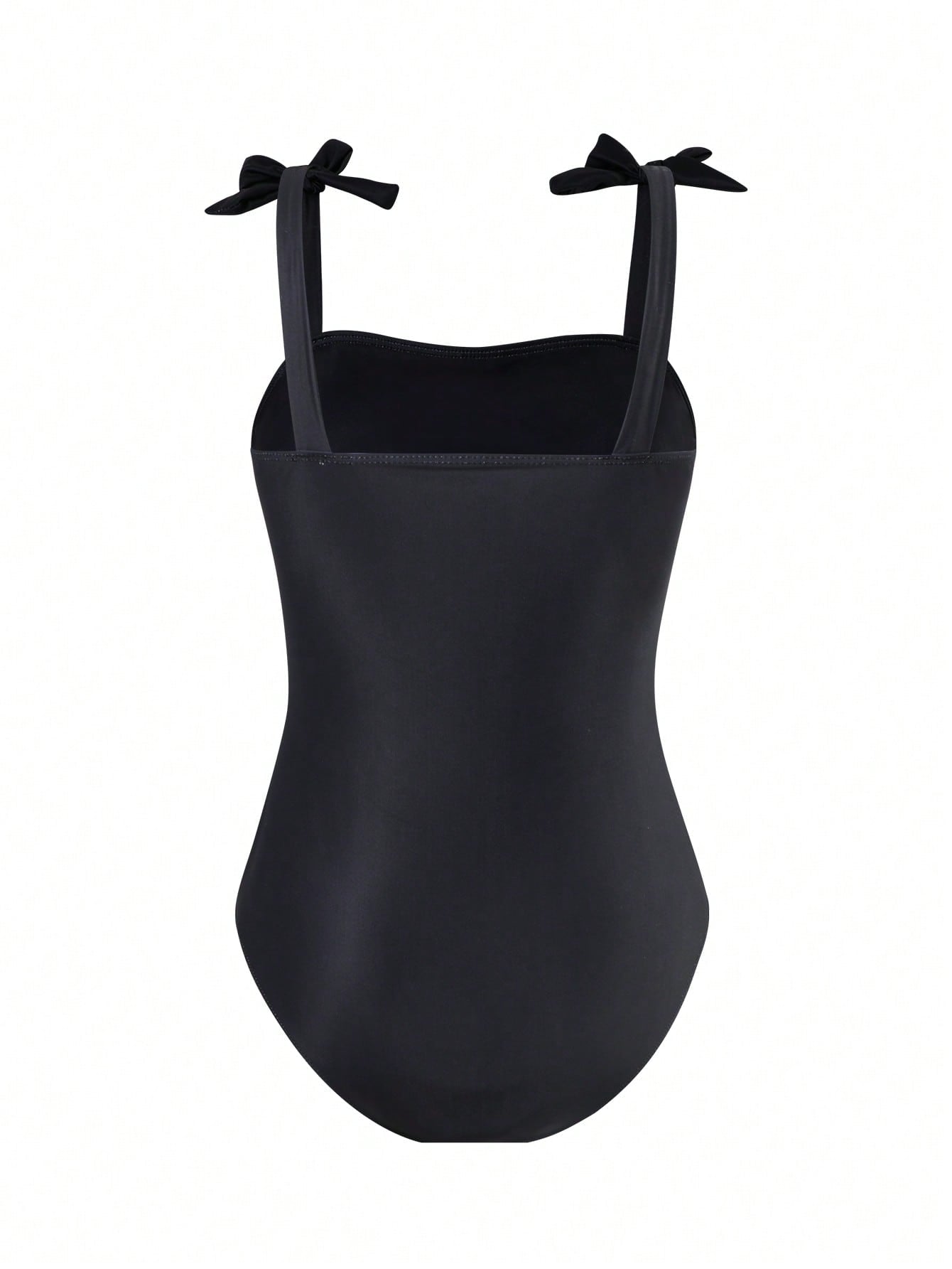 Tween girl black floral one-piece swimsuit set with spaghetti straps, asymmetrical detail, bow decor, and mid-waist bottom for beach, pool, and summer vacation wear.