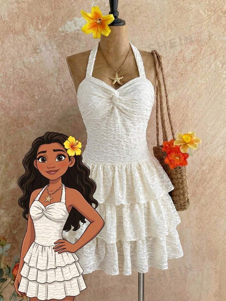 Beige tween girls halter dress with textured jacquard fabric, plant pattern, shirred detail, zipper closure, and layered tiered ruffle hem for vacation wear