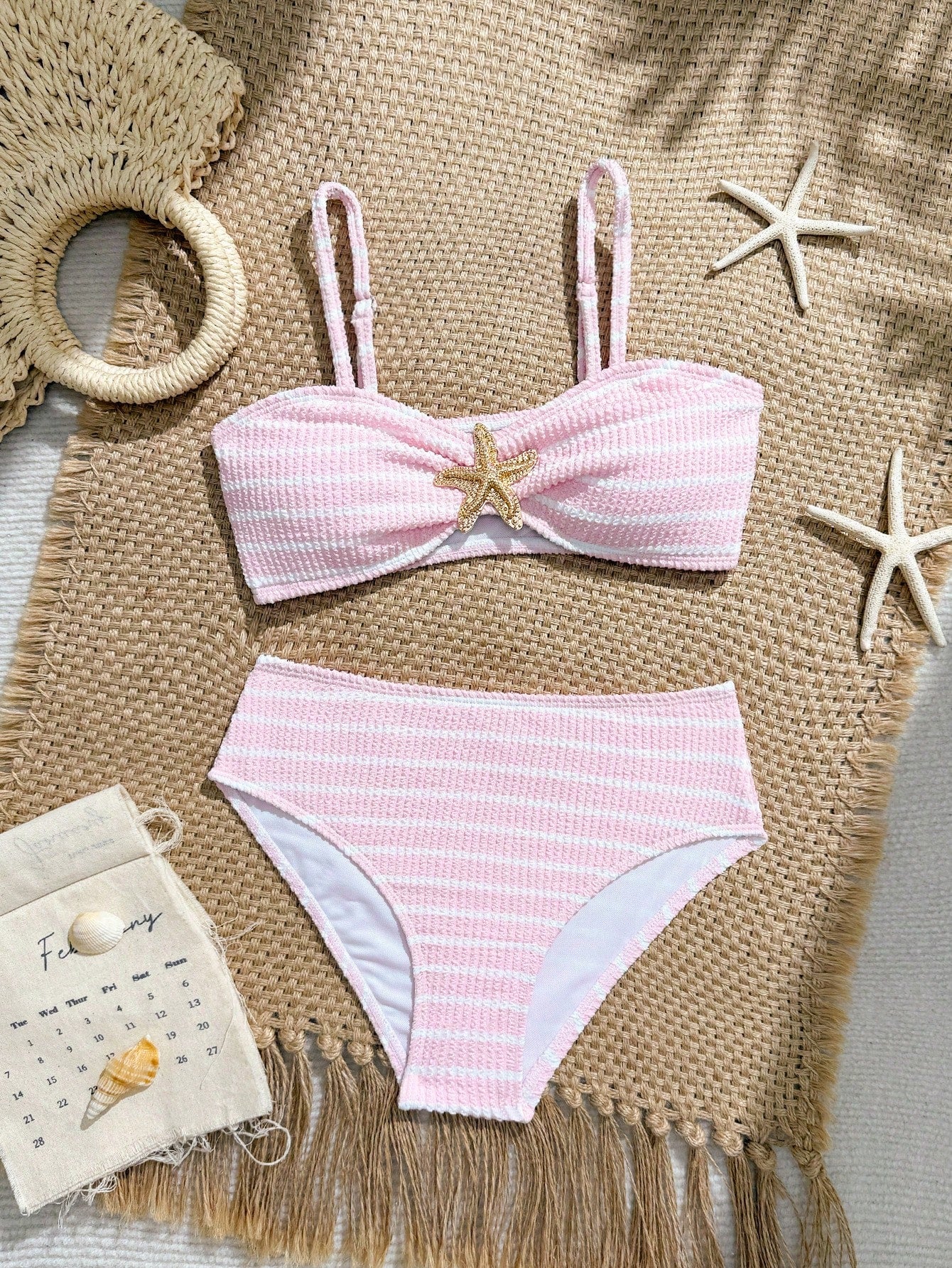 Tween girls pink and white striped two-piece bikini set with spaghetti strap bandeau top, starfish decor, and high waist swim bottoms for beach and vacation wear