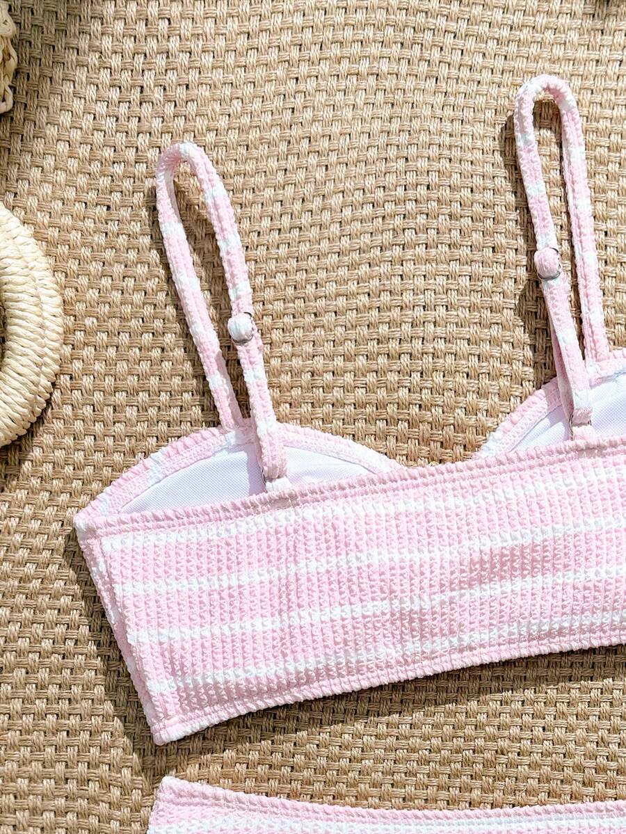 Tween girls pink and white striped two-piece bikini set with spaghetti strap bandeau top, starfish decor, and high waist swim bottoms for beach and vacation wear