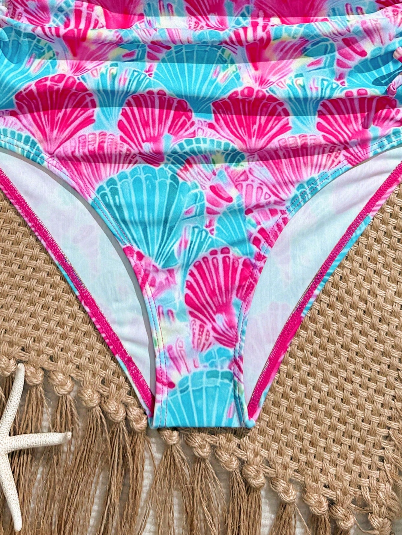 Blue halter one-piece swimsuit for tween girls with full geometric print, wireless bra design, mid-waist bottom, and medium-stretch fabric for beach and pool wear.