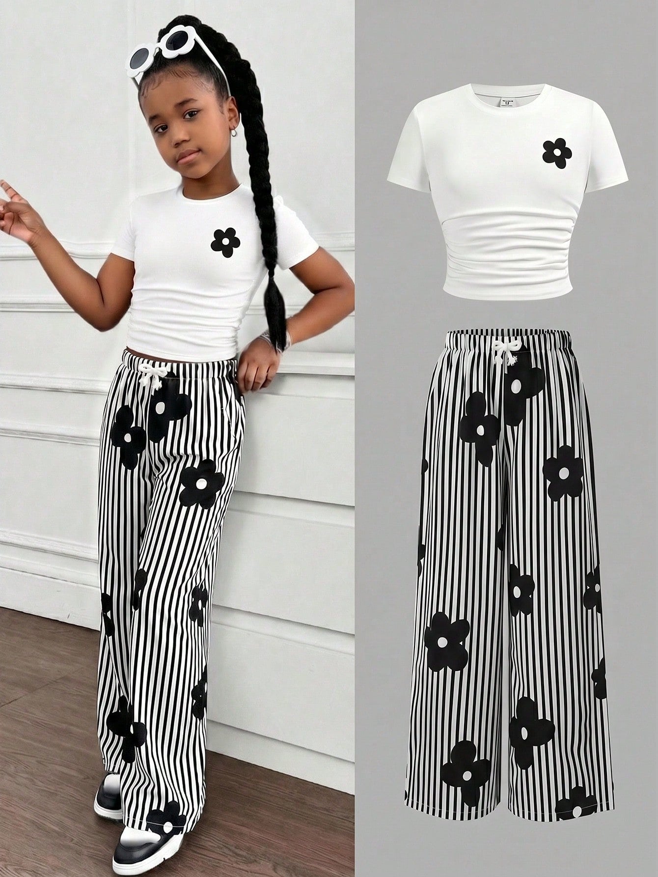 Tween girl 2-piece summer set featuring a white printed short-sleeve T-shirt and black and white striped long pants.