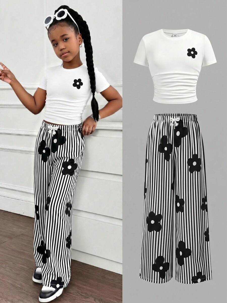Tween girl 2-piece summer set featuring a white printed short-sleeve T-shirt and black and white striped long pants.