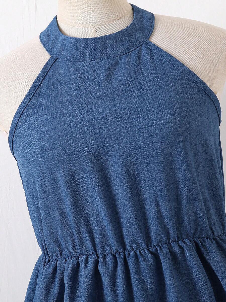 Tween girls blue sleeveless halter A-line mini dress featuring a cutout detail, high waist, flared hem, and zipper closure.