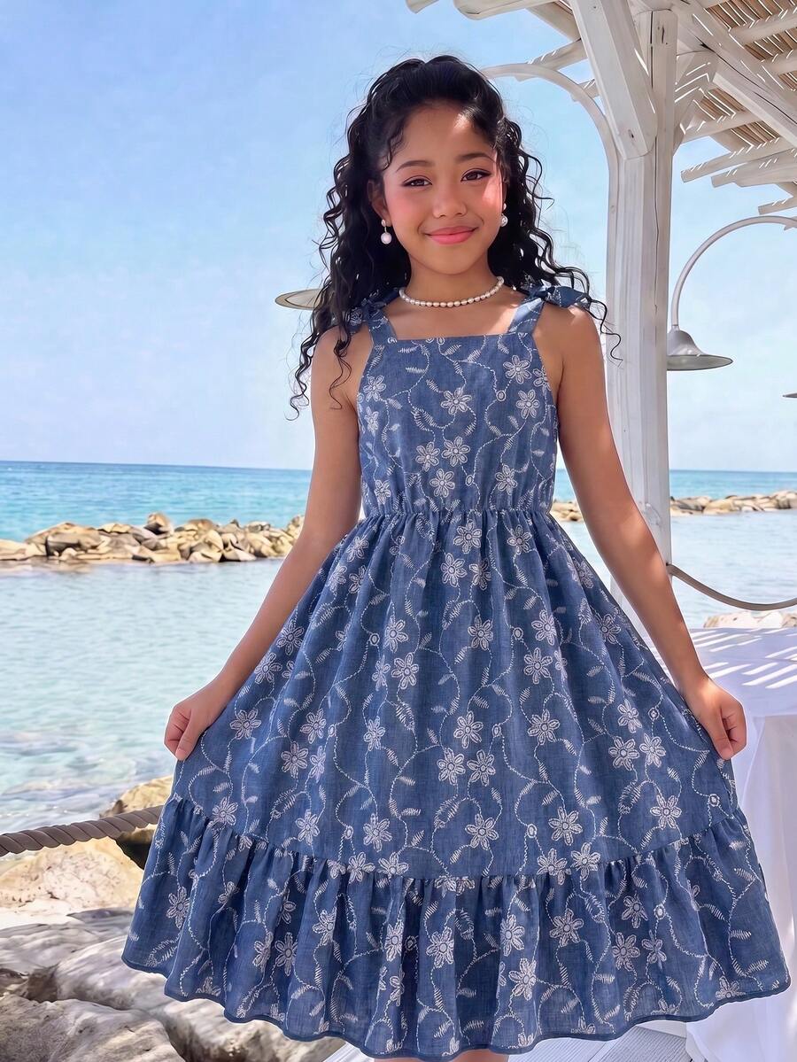 Tween girls blue sleeveless halter A-line mini dress featuring a cutout detail, high waist, flared hem, and zipper closure.