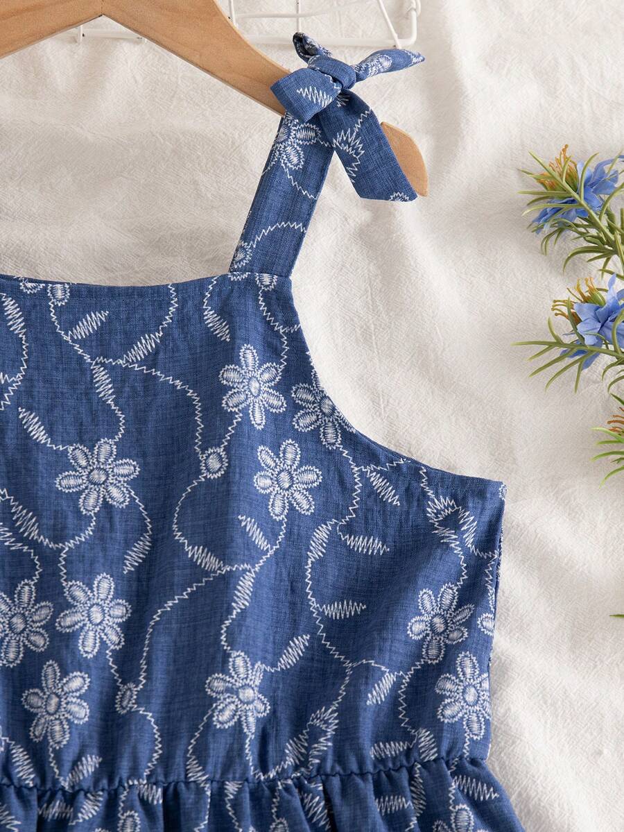 Tween girls blue sleeveless halter A-line mini dress featuring a cutout detail, high waist, flared hem, and zipper closure.