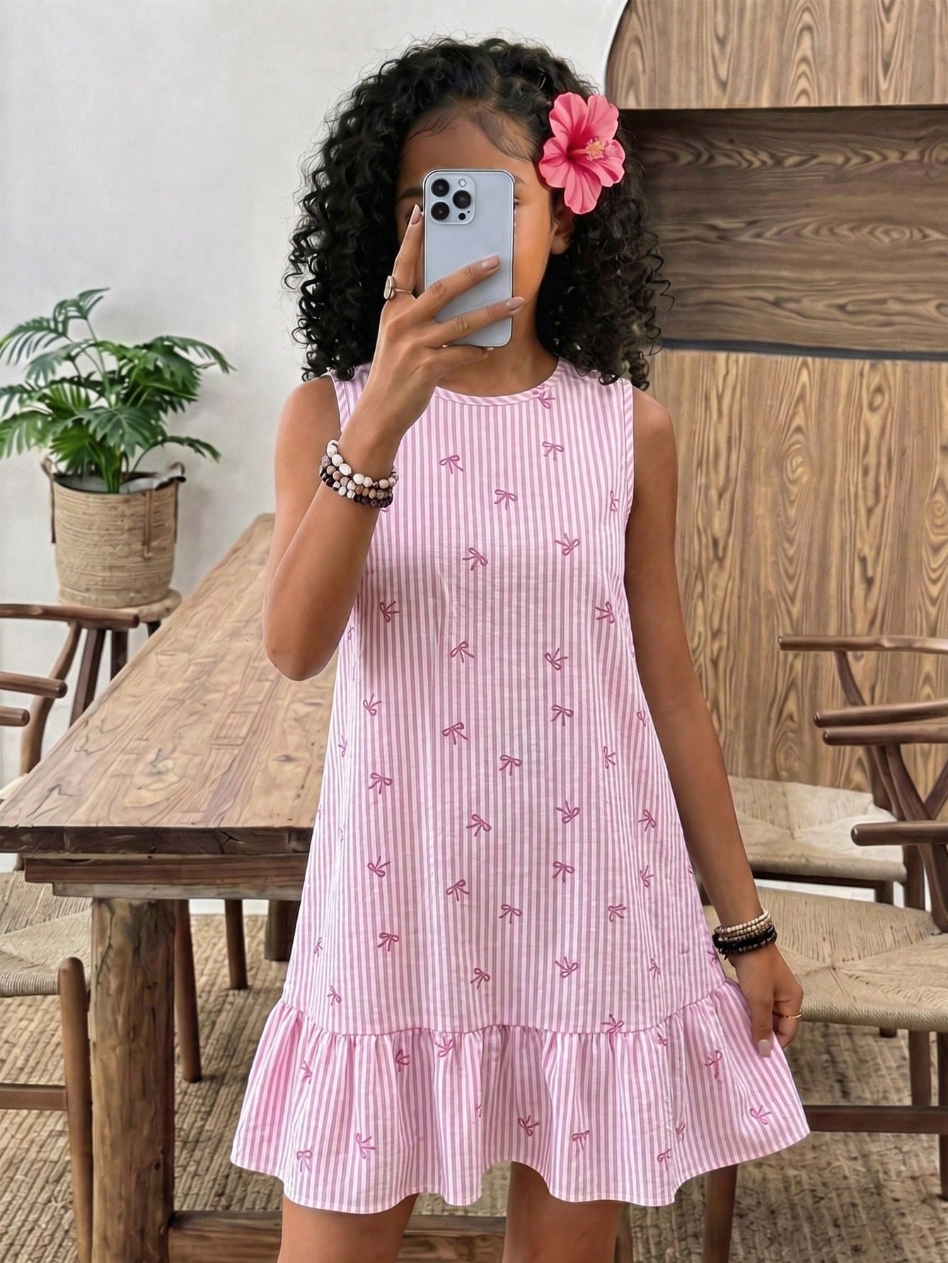 Tween girls casual leopard print smock mini dress featuring a round neck and flounce ruffle hem.