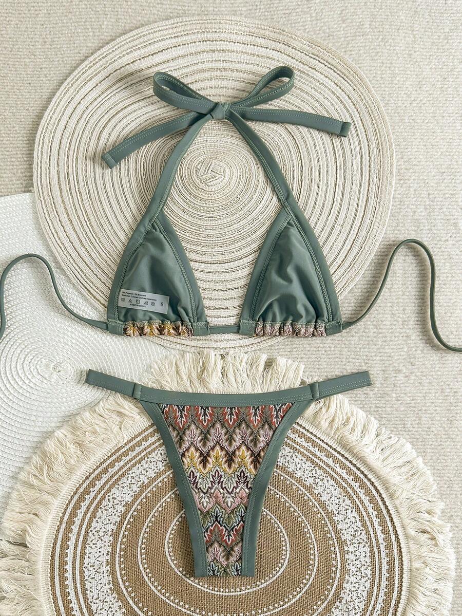 Women's multicolor 2-piece textured knit bikini set featuring high-waisted high-cut bottoms and a strap top with tie back detailing and geometric pattern.