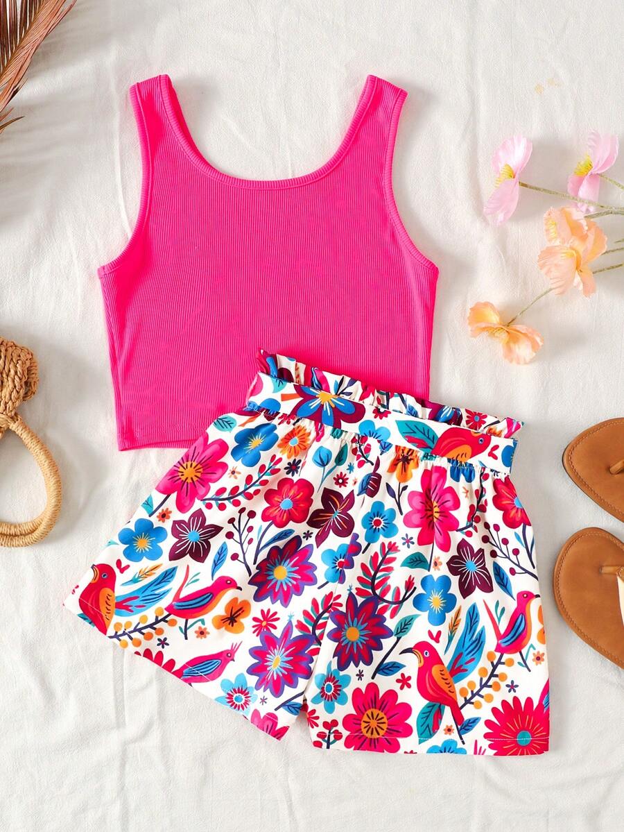 Tween girl wearing a casual 2-piece set featuring a black rib-knit scoop neck tank top and leopard print paperbag waist shorts with a matching belt.
