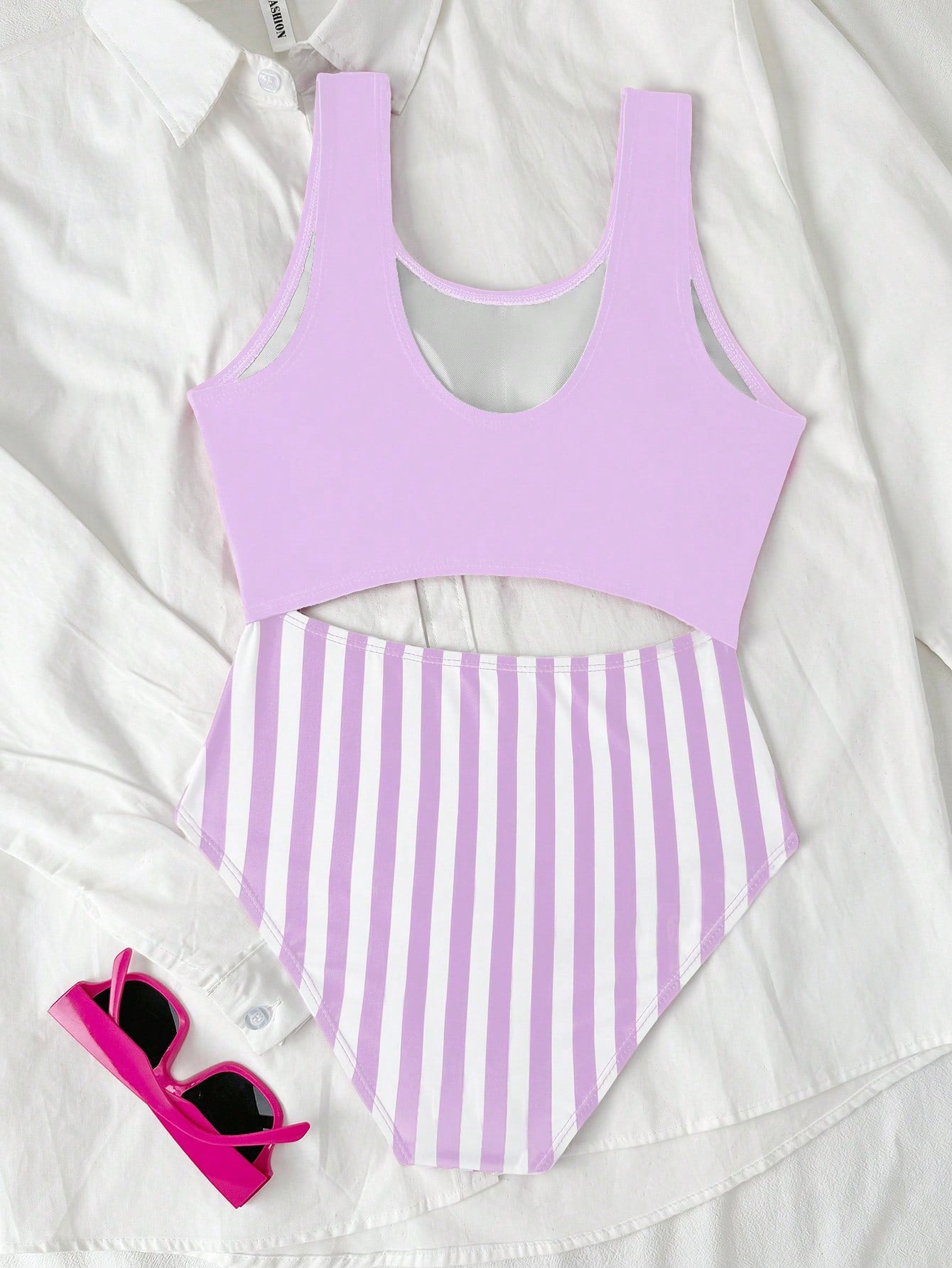 Purple tween girls one-piece swimsuit with asymmetrical neckline, cut-out waist, striped pattern, fitted silhouette, and lined body.