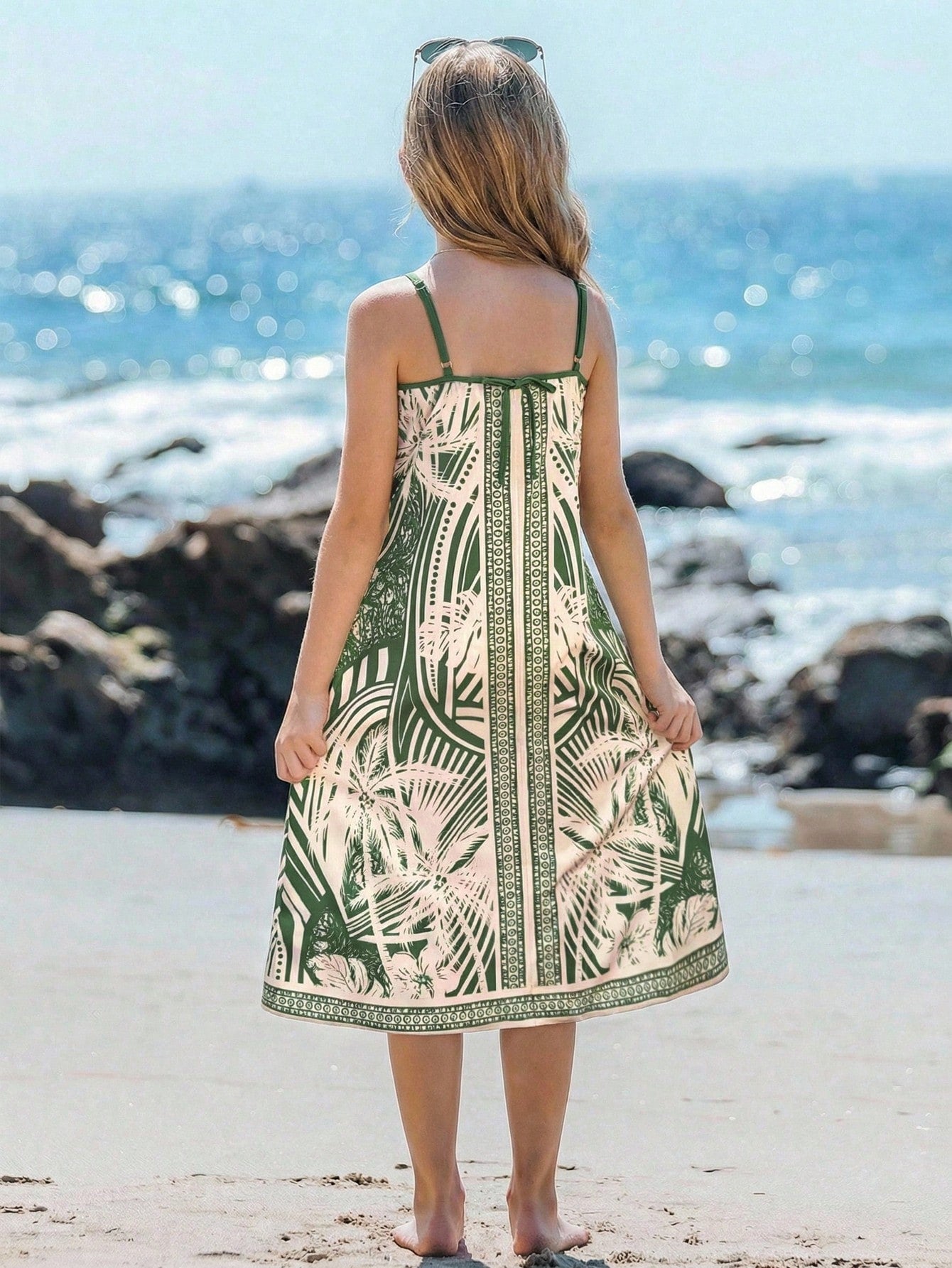 tween girls multicolor all-over printed spaghetti strap boho cami dress with sleeveless design, natural waist, flared hem, and long slim fit silhouette.