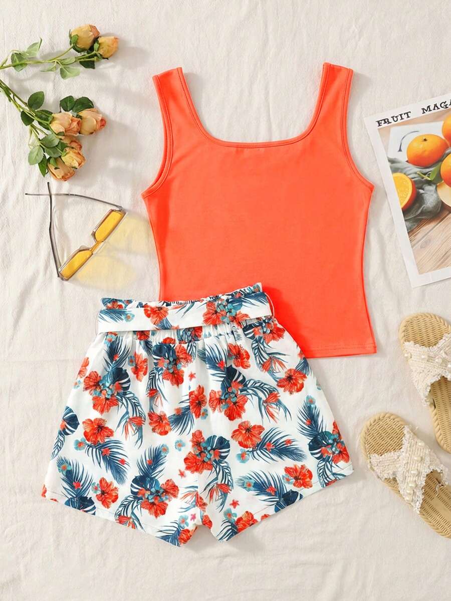 Tween girls 2-piece summer set featuring a turquoise blue ribbed tank top and tropical leaf pattern belted shorts.