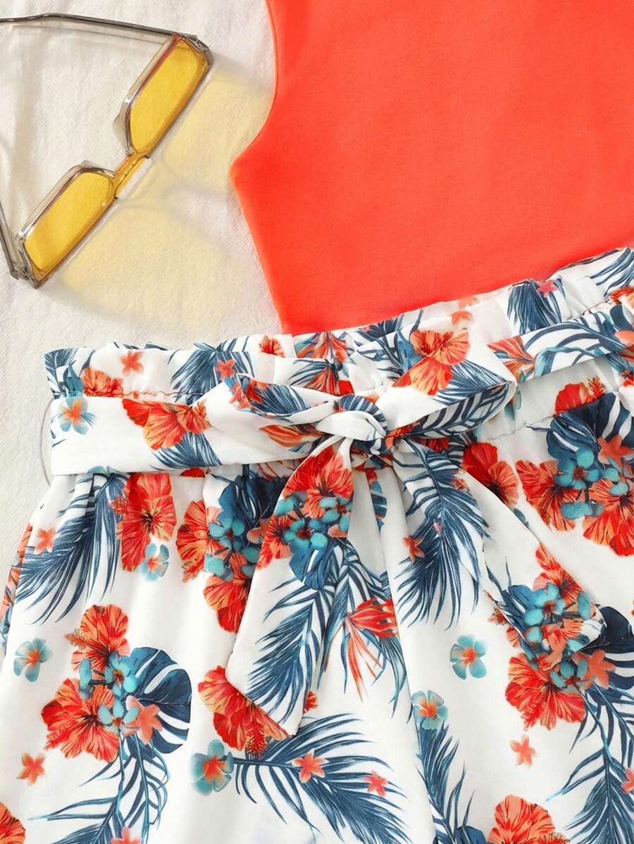 Tween girls 2-piece summer set featuring a turquoise blue ribbed tank top and tropical leaf pattern belted shorts.