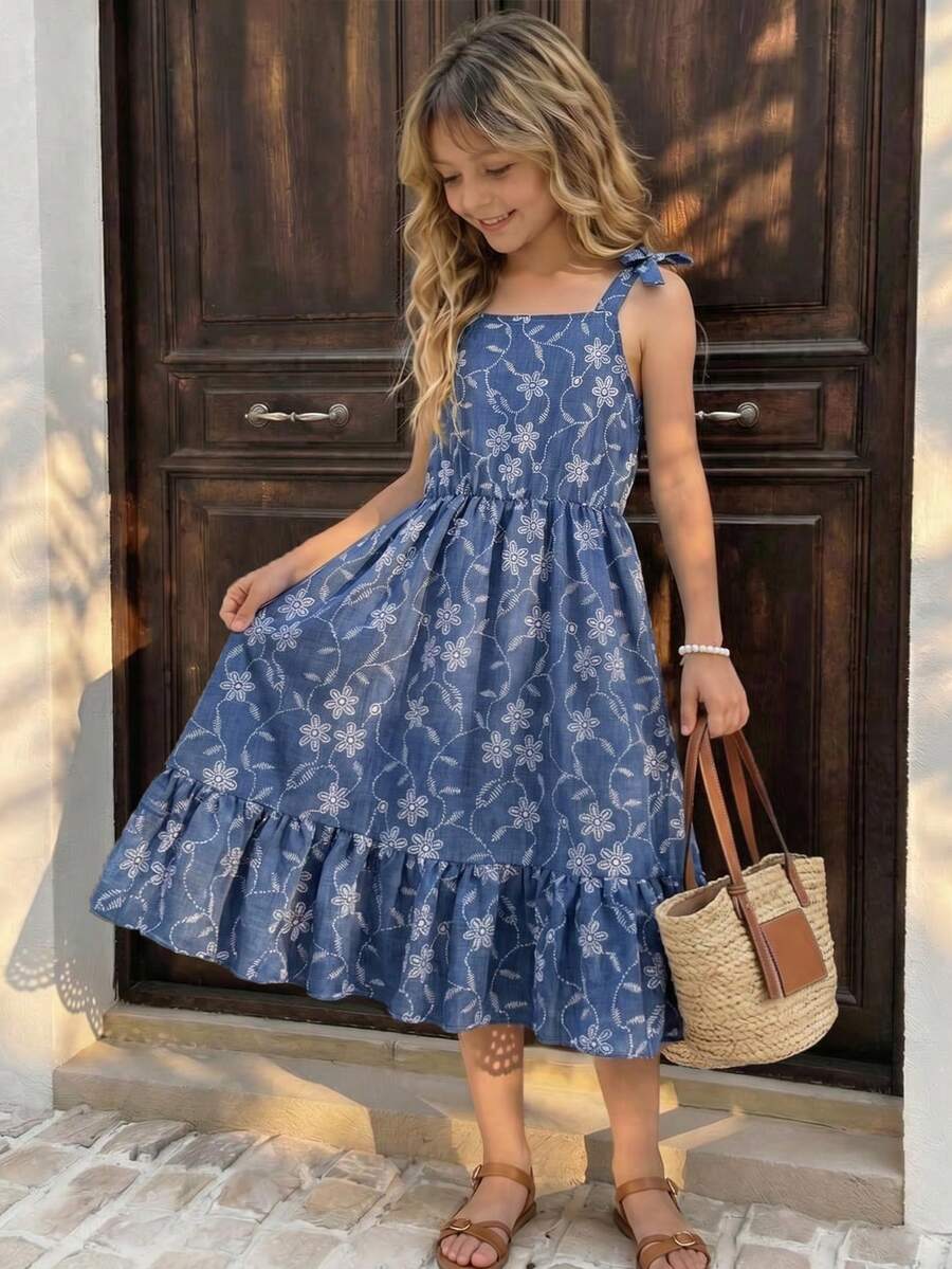 Tween girls blue sleeveless halter A-line mini dress featuring a cutout detail, high waist, flared hem, and zipper closure.