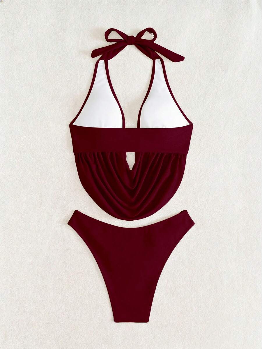 Women's 2-piece bikini set featuring a black deep V-neck lace-up crop top and high cut bikini bottom for beach and vacation wear.