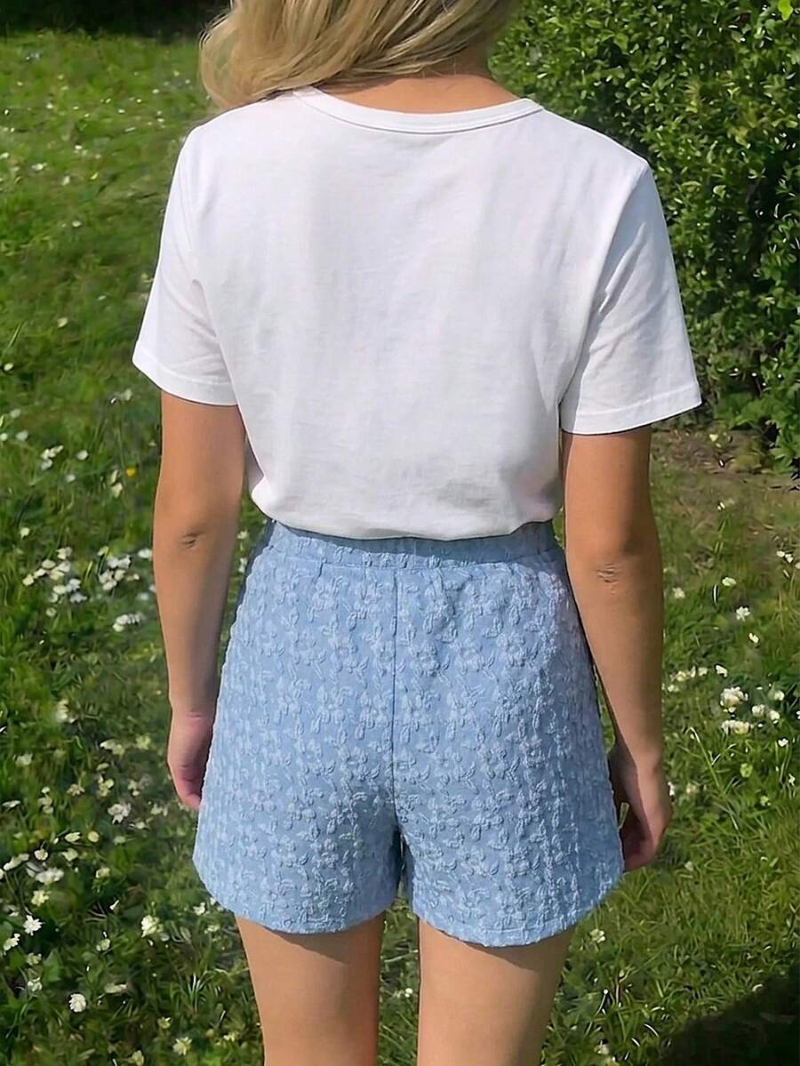 Tween girls 2-piece blue outfit featuring a short sleeve round neck t-shirt with a bow front detail and an asymmetric wrap skort.