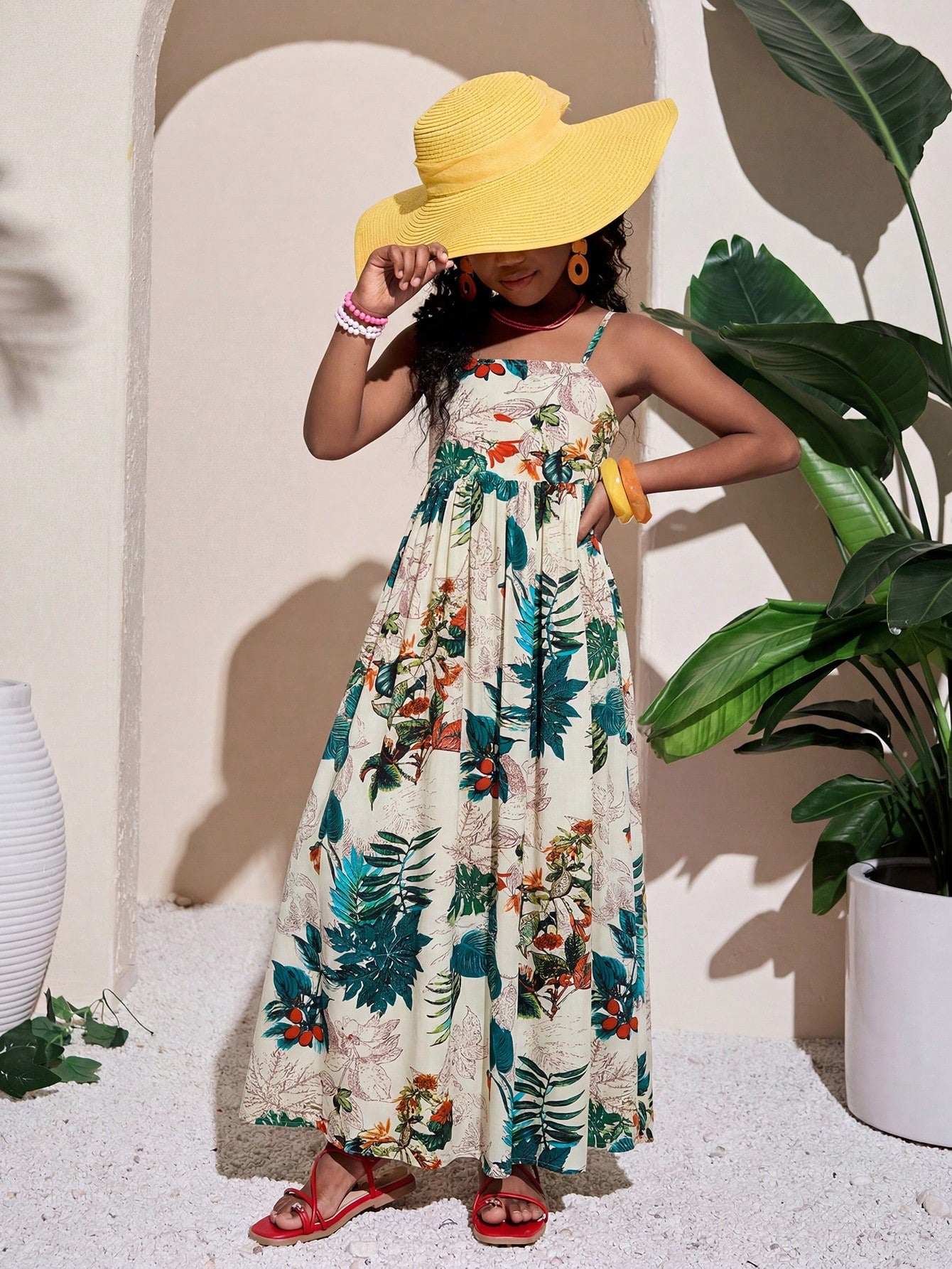 Tween girls striped spaghetti strap cami dress with high waist, shirred detail, zipper closure, sleeveless design, and flared long A-line silhouette for vacation wear.