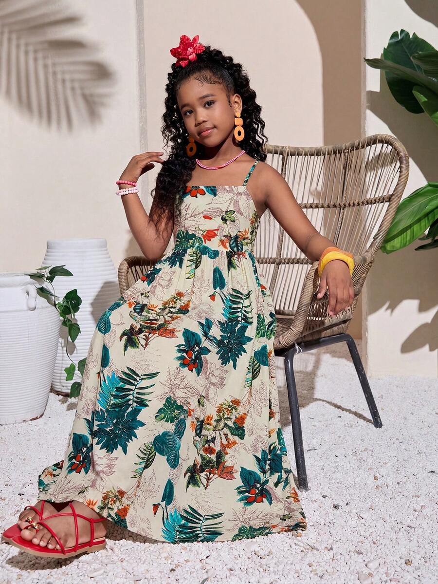 Tween girls blue striped summer camisole dress featuring spaghetti straps, high waist, flared hem, and back zipper detail.