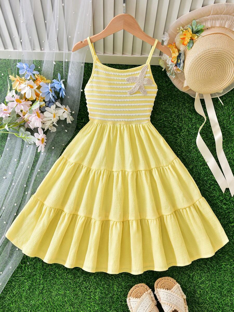 Tween girls yellow sleeveless cami dress with spaghetti straps, high waist, tiered layered skirt, shirred detail, zipper closure, and casual vacation style.