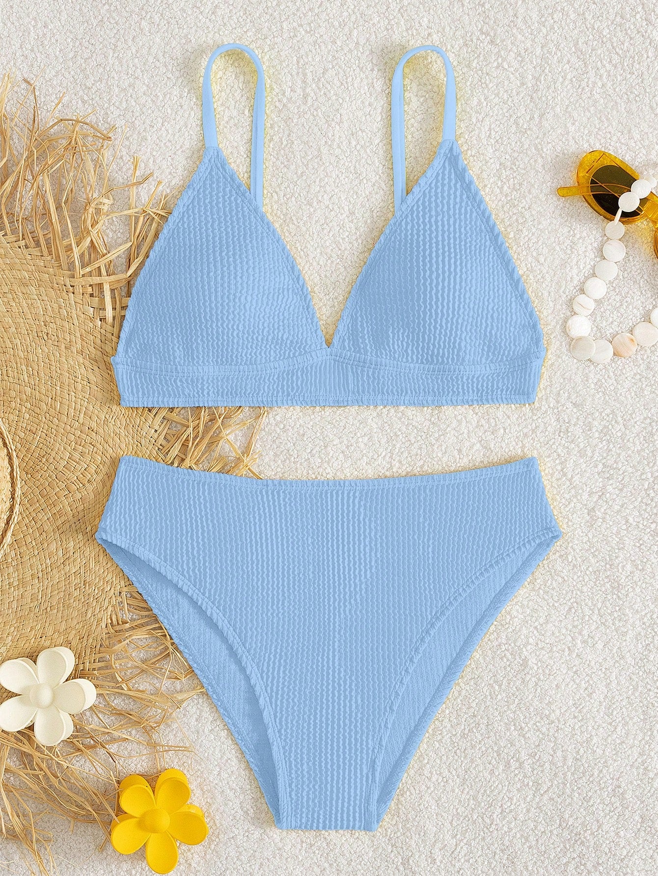 Tween girls two-piece bikini swimwear set with a solid color textured design, spaghetti strap top, wireless bra, and mid-waist lined bikini bottoms.