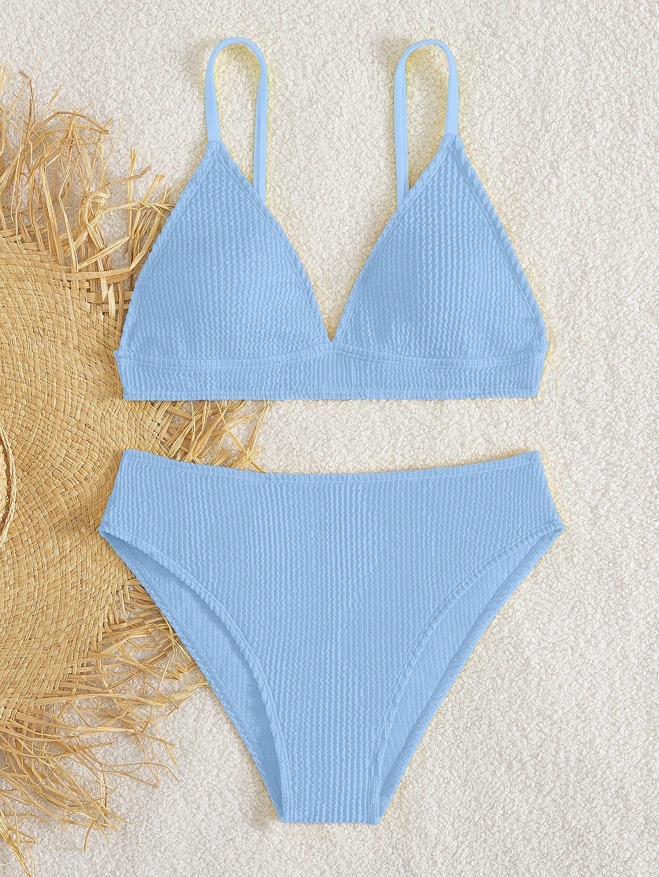 Tween girls two-piece bikini swimwear set with a solid color textured design, spaghetti strap top, wireless bra, and mid-waist lined bikini bottoms.