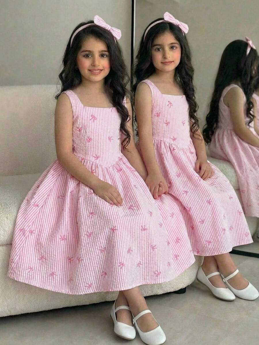 Tween girls pink floral sleeveless A-line midi dress featuring round neck, high waist with belt, contrast lace, and zipper back.